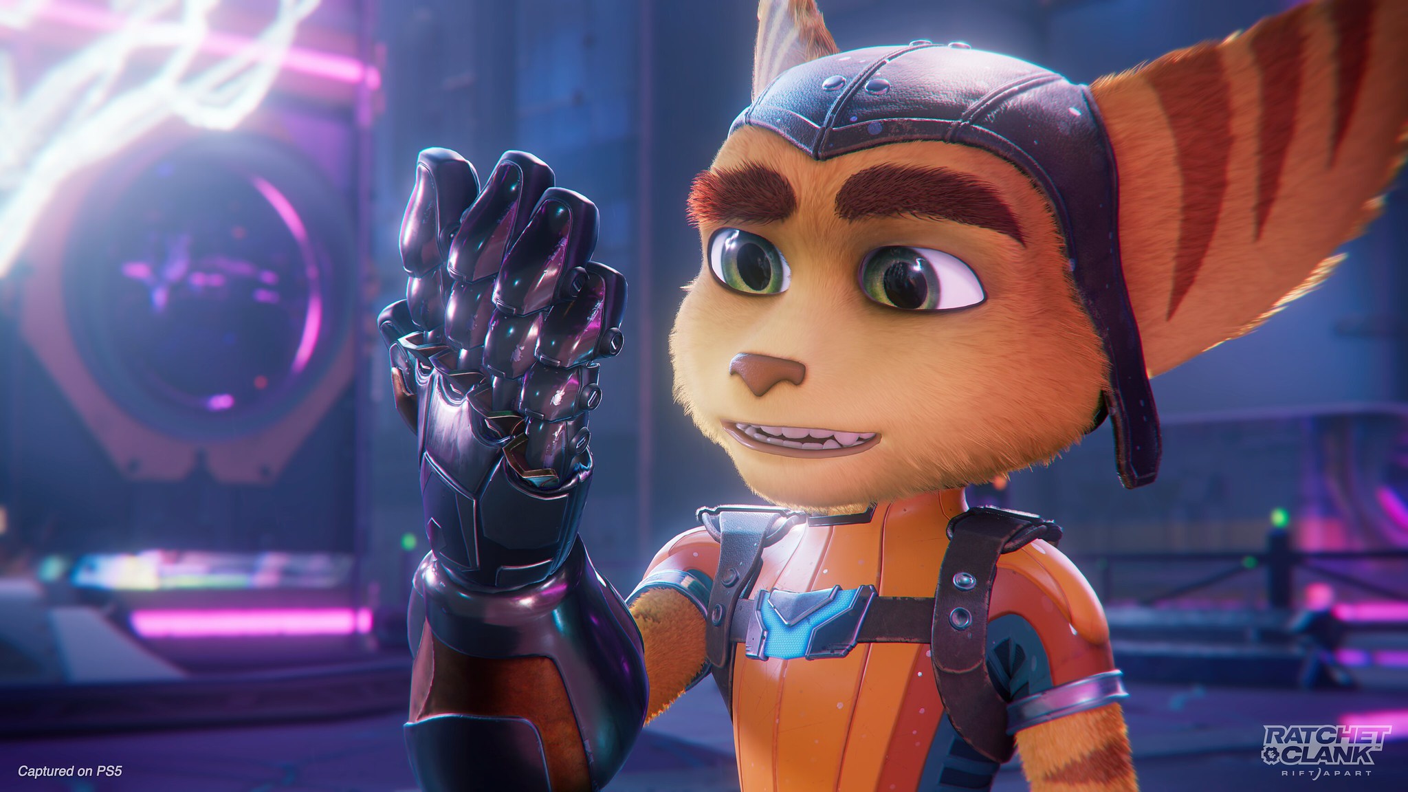 Ratchet, from 2020’s Ratchet &amp; Clank: Rift Apart, looks at the cybernetic left hand fitted to his body.