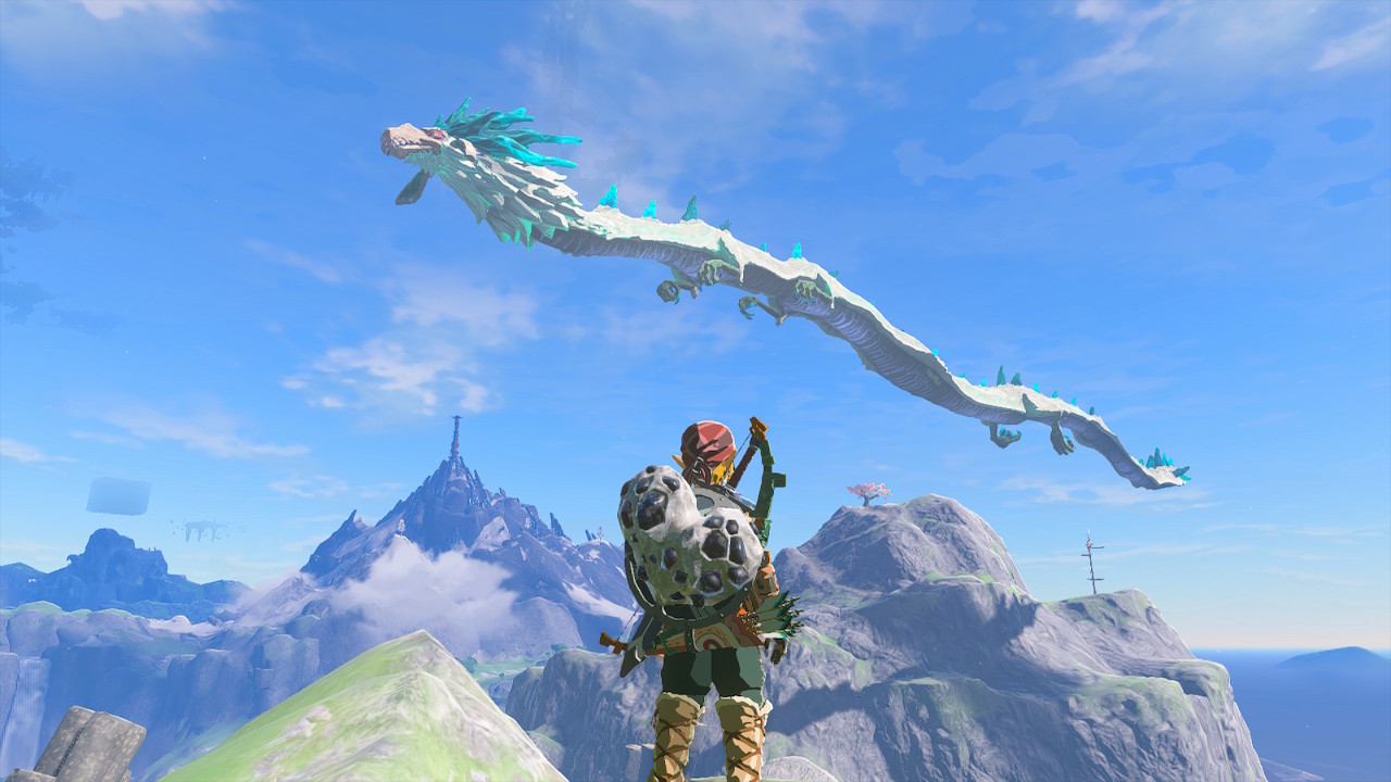Link stands on a cliff watching the dragon Naydra in Zelda: Tears of the Kingdom