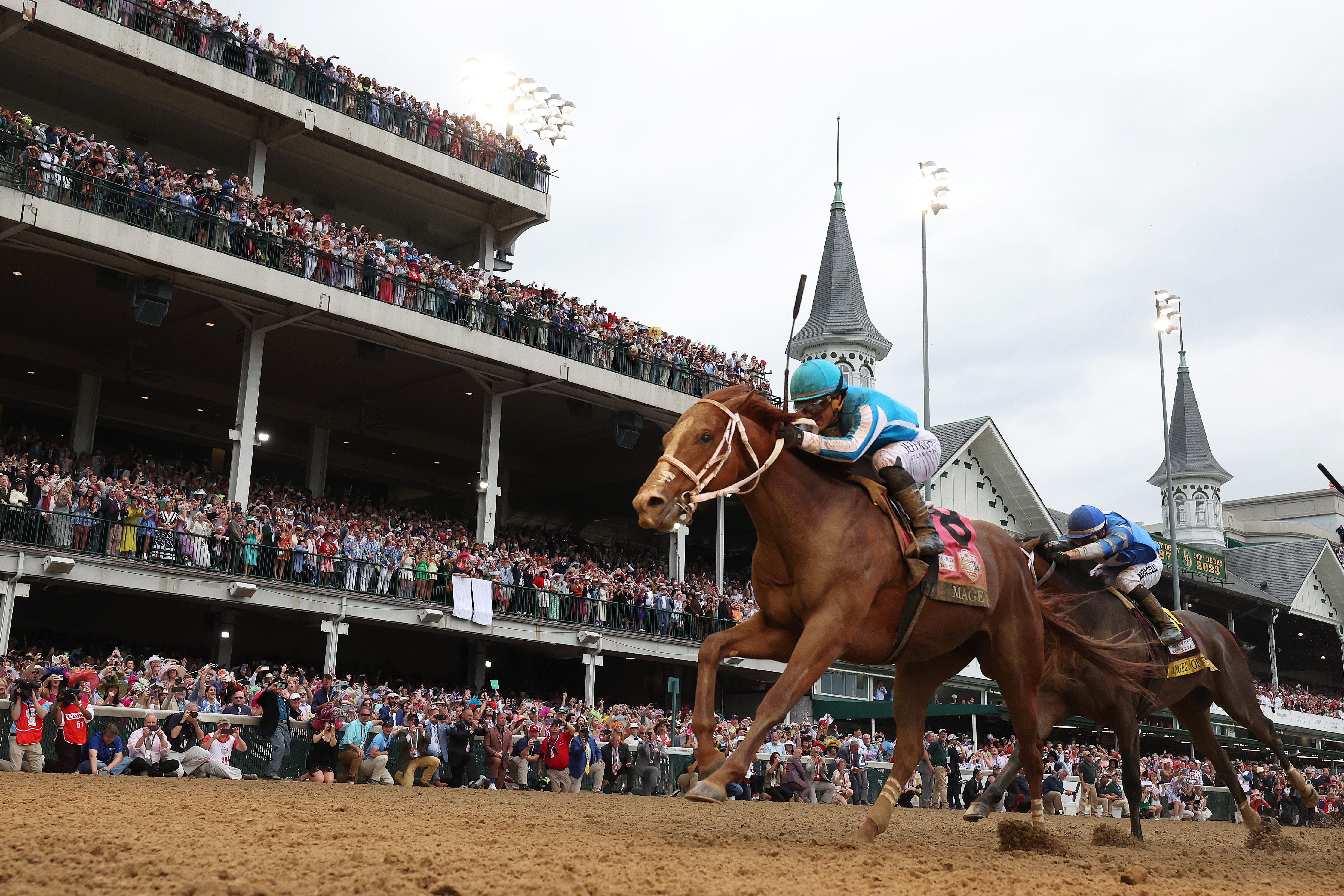 Mage #8, ridden by jockey Javier Castellano crosses the finish line to win the 149th running of the Kentucky Derby at Churchill Downs on May 06, 2023 in Louisville, Kentucky.
