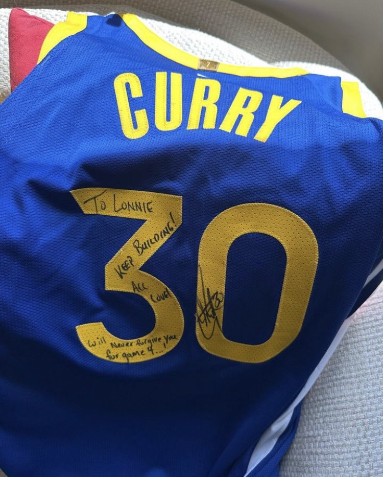 The back of a Stephen Curry jersey that the Warriors star gave to Lakers guard Lonnie Walker, signed “To Lonnie, Keep Building! All Love. Will never forgive you for Game 4...!” and Curry’s signature.