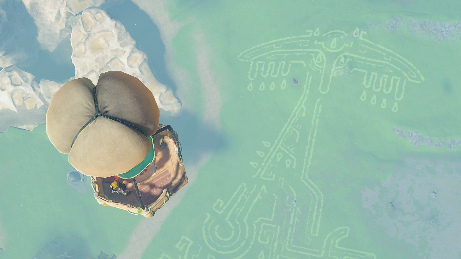 The Legend of Zelda: Tears of the Kingdom Link and Impa riding a hot air balloon over a geoglyph and Tear of the Dragon