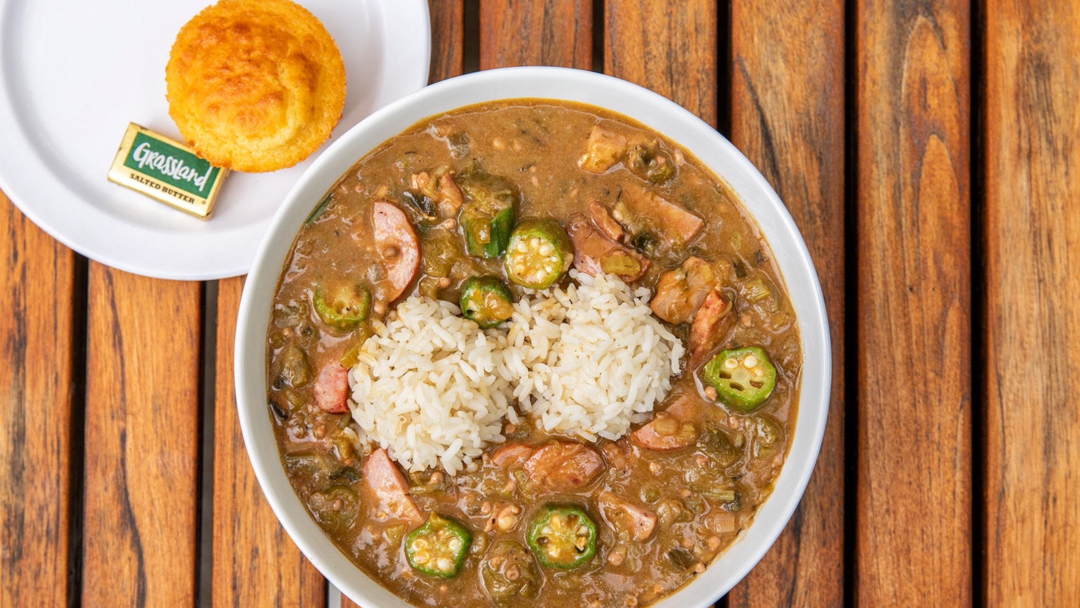 A bowl of gumbo with rice.