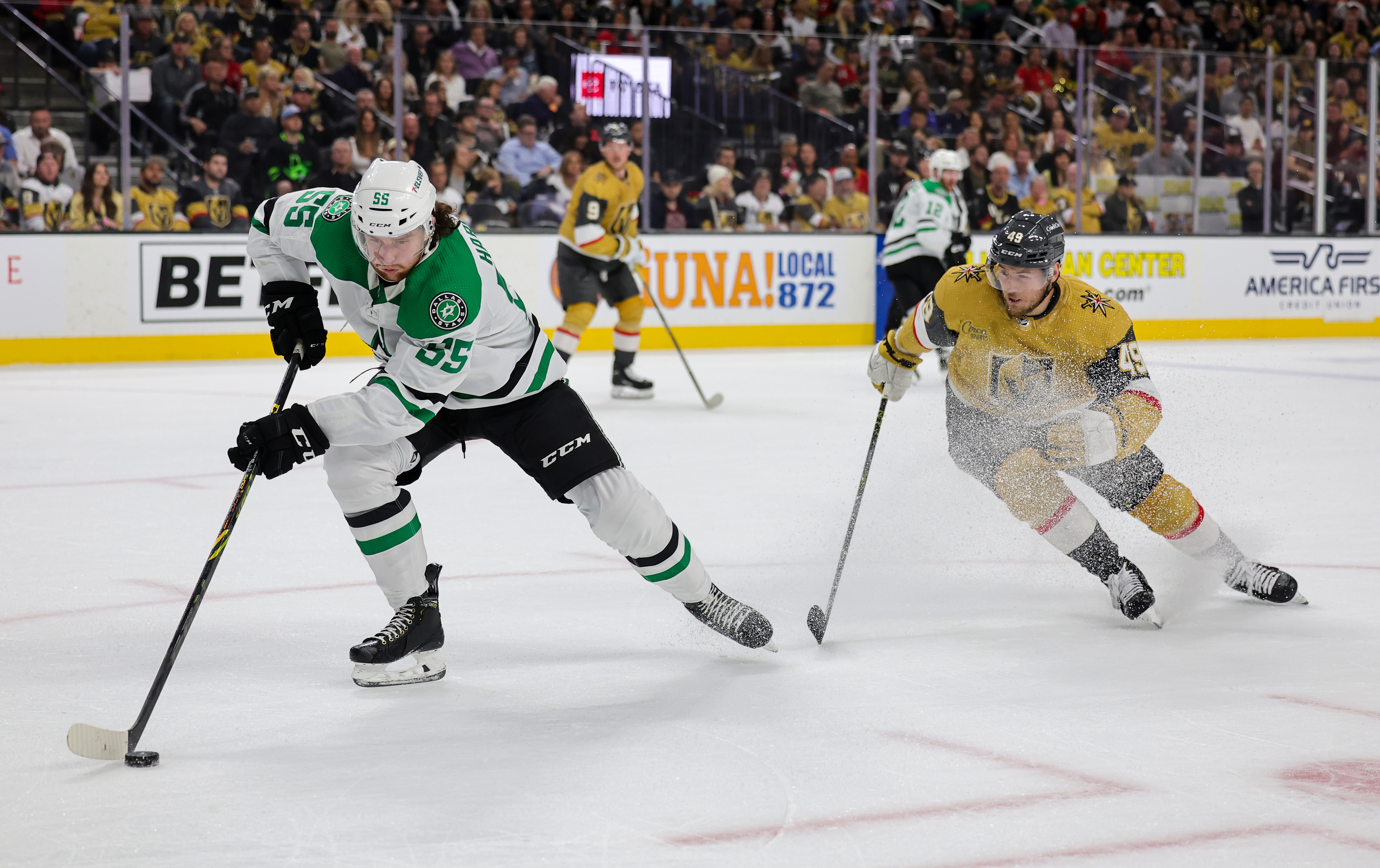 Thomas Harley #55 of the Dallas Stars skates with the puck ahead of Ivan Barbashev #49 of the Vegas Golden Knights in the second period of Game One of the Western Conference Final of the 2023 Stanley Cup Playoffs at T-Mobile Arena on May 19, 2023 in Las Vegas, Nevada. The Golden Knights defeated the Stars 4-3 in overtime.