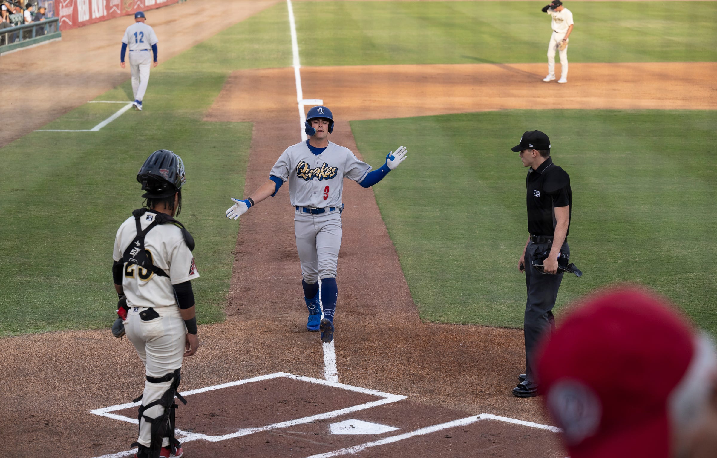 Rancho Cucamonga Chris Newell scores against Visalia Rawhide during the home opener Tuesday, April 11, 2023