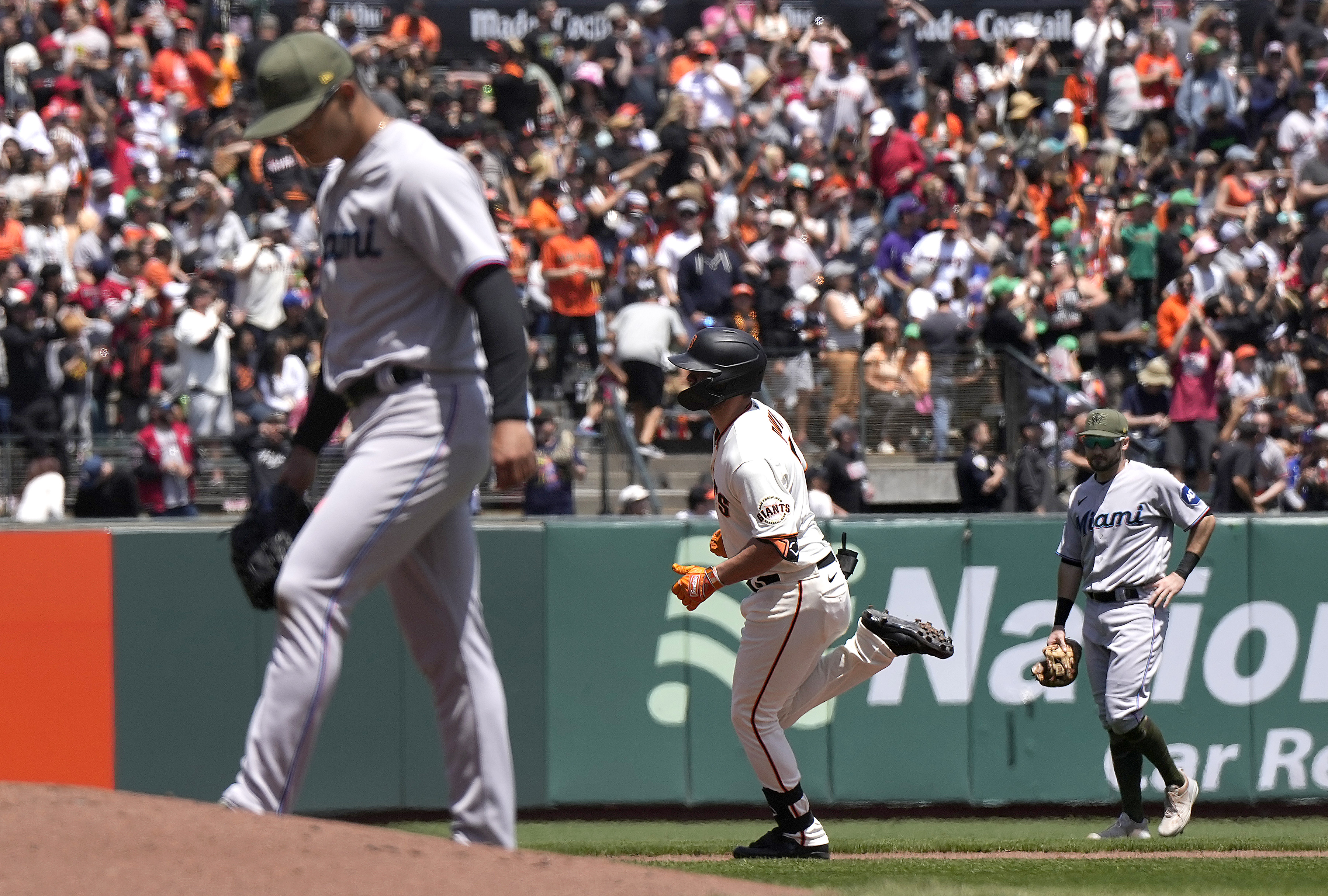 J.D. Davis #7 of the San Francisco Giants trots around the bases after hitting a two-run home run off of Jesus Luzardo #44 of the Miami Marlins in the bottom of the third inning a