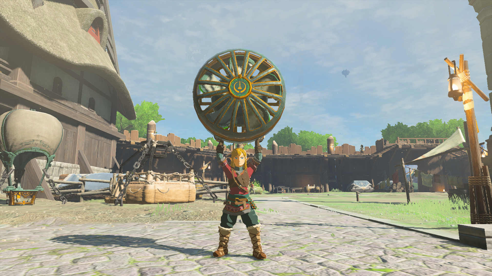 An image of Link in The Legend of Zelda: Tears of the Kingdom holding a fan over his head. 