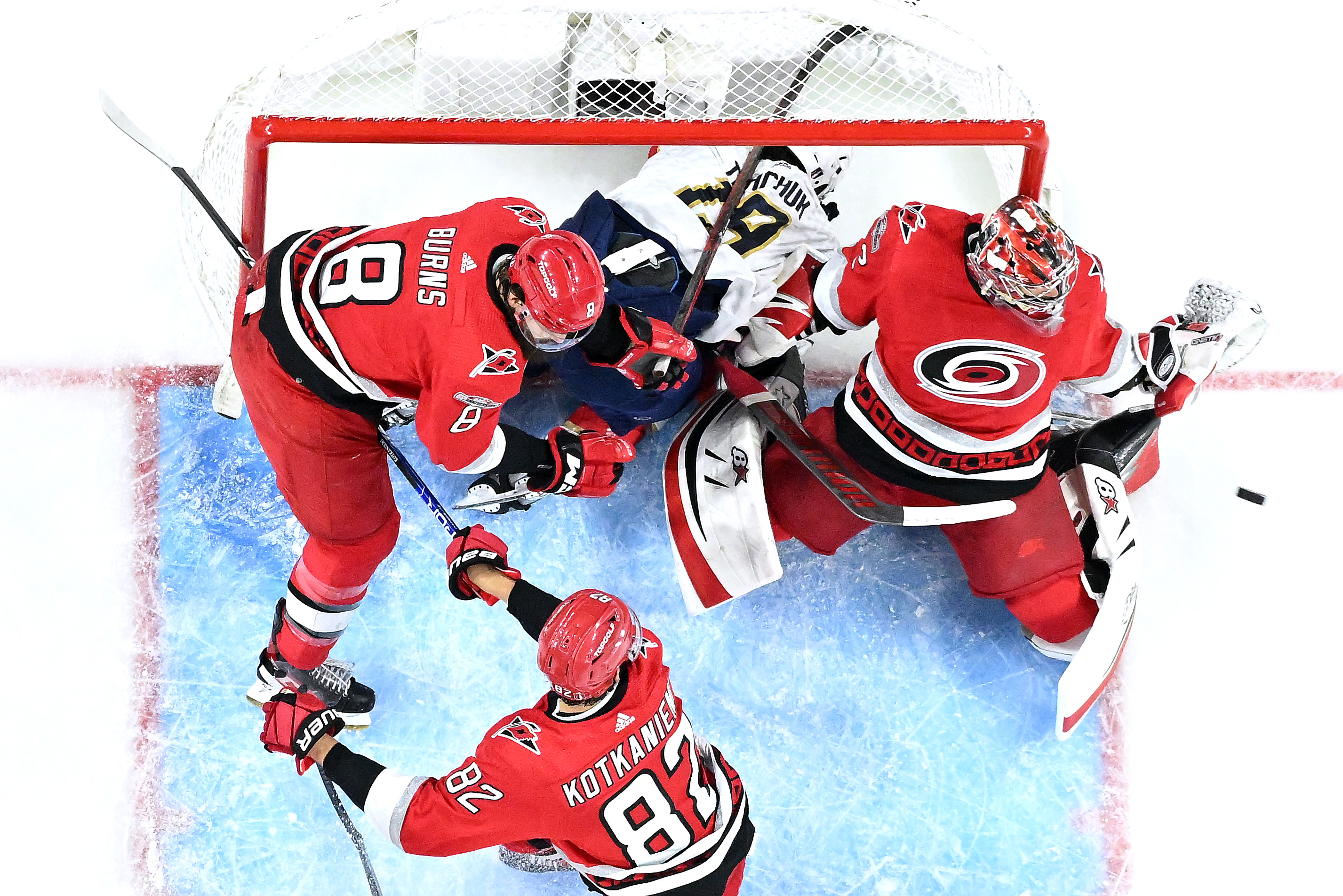 Antti Raanta of the Carolina Hurricanes deflects a shot as Matthew Tkachuk of the Florida Panthers crashes into the net during Game Two of the Eastern Conference Finals of the 2023 Stanley Cup Playoffs at PNC Arena on May 20, 2023 in Raleigh, North Carolina.