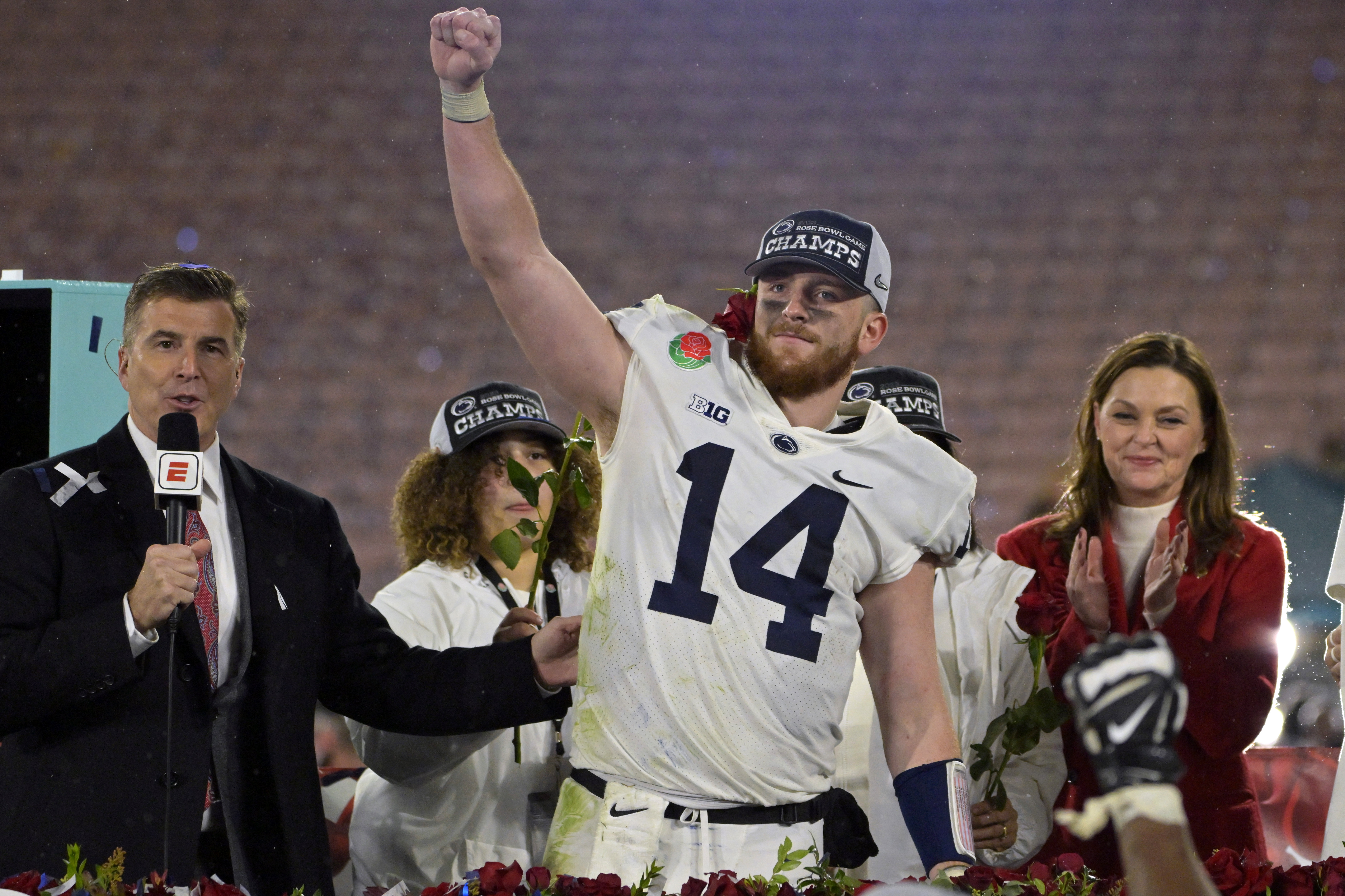 Jan 2, 2023; Pasadena, California, USA; Penn State Nittany Lions quarterback Sean Clifford (14) celebrates on the podium after defeating the Utah Utes in the 109th Rose Bowl game at the Rose Bowl.