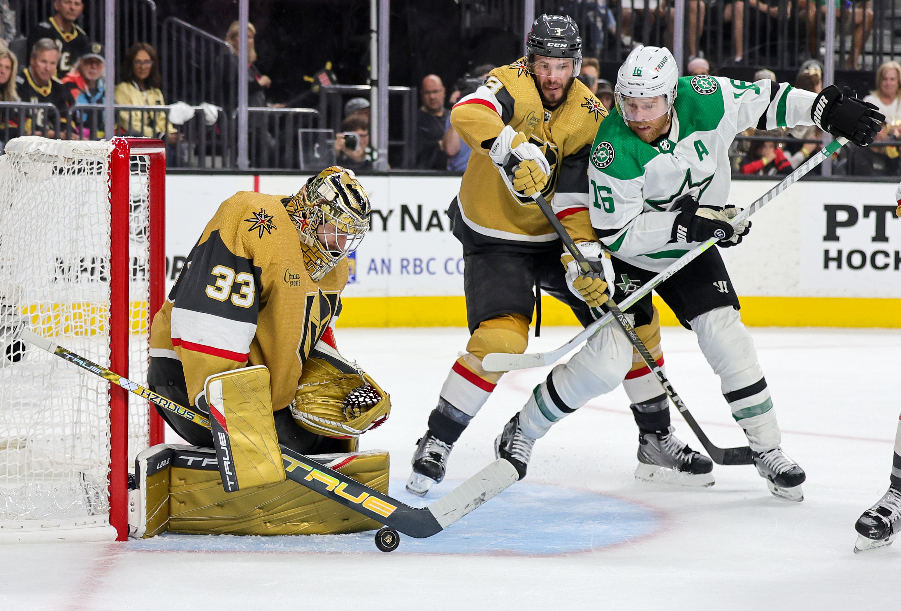 Adin Hill of the Vegas Golden Knights makes a save as Brayden McNabb of the Golden Knights and Joe Pavelski of the Dallas Stars look for a rebound in the third period of Game Two of the Western Conference Final of the 2023 Stanley Cup Playoffs at T-Mobile Arena on May 21, 2023 in Las Vegas, Nevada. The Golden Knights defeated the Stars 3-2 in overtime.