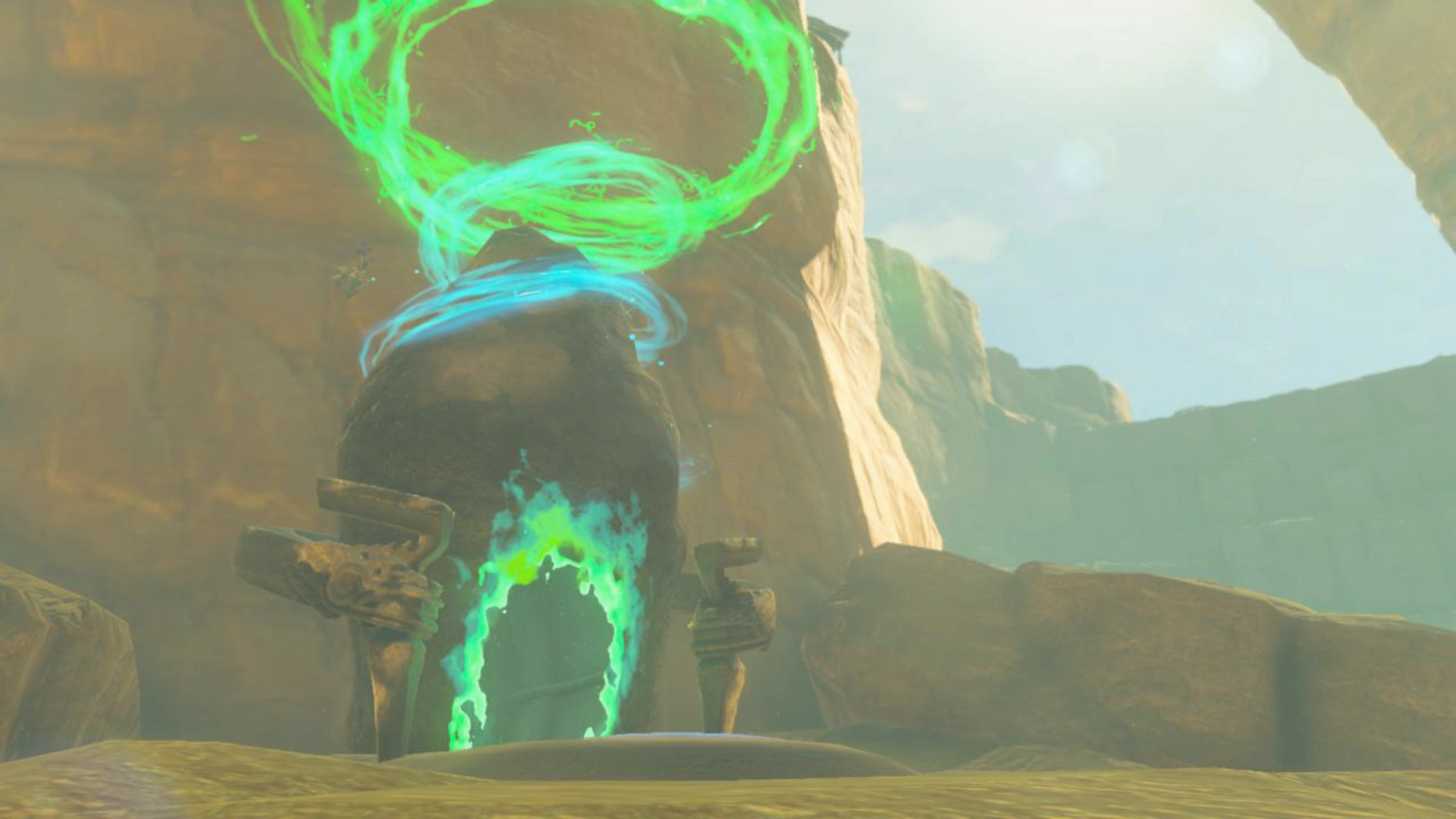 A screenshot shows a shrine in The Legend of Zelda: Tears of the Kingdom. It looks like a rock emitting swirling green energy.