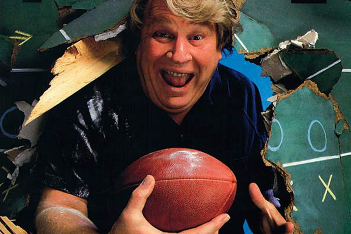 John Madden Football (1988) cover art with Madden holding a football and bursting through a chalkboard