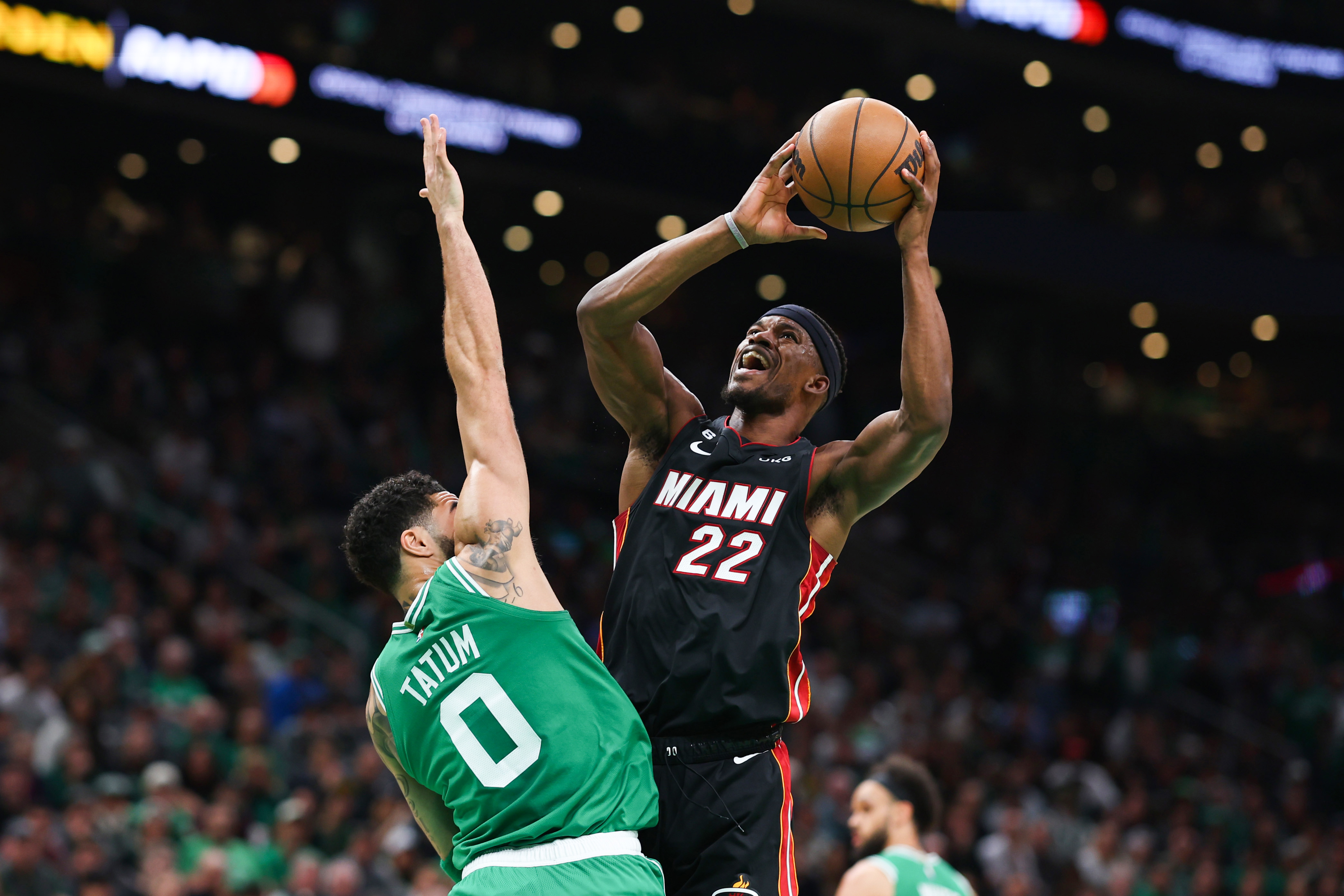 BOSTON, MASSACHUSETTS - MAY 25: Jimmy Butler #22 of the Miami Heat drives against Jayson Tatum #0 of the Boston Celtics during the first quarter in game five of the Eastern Conference Finals at TD Garden on May 25, 2023 in Boston, Massachusetts.
