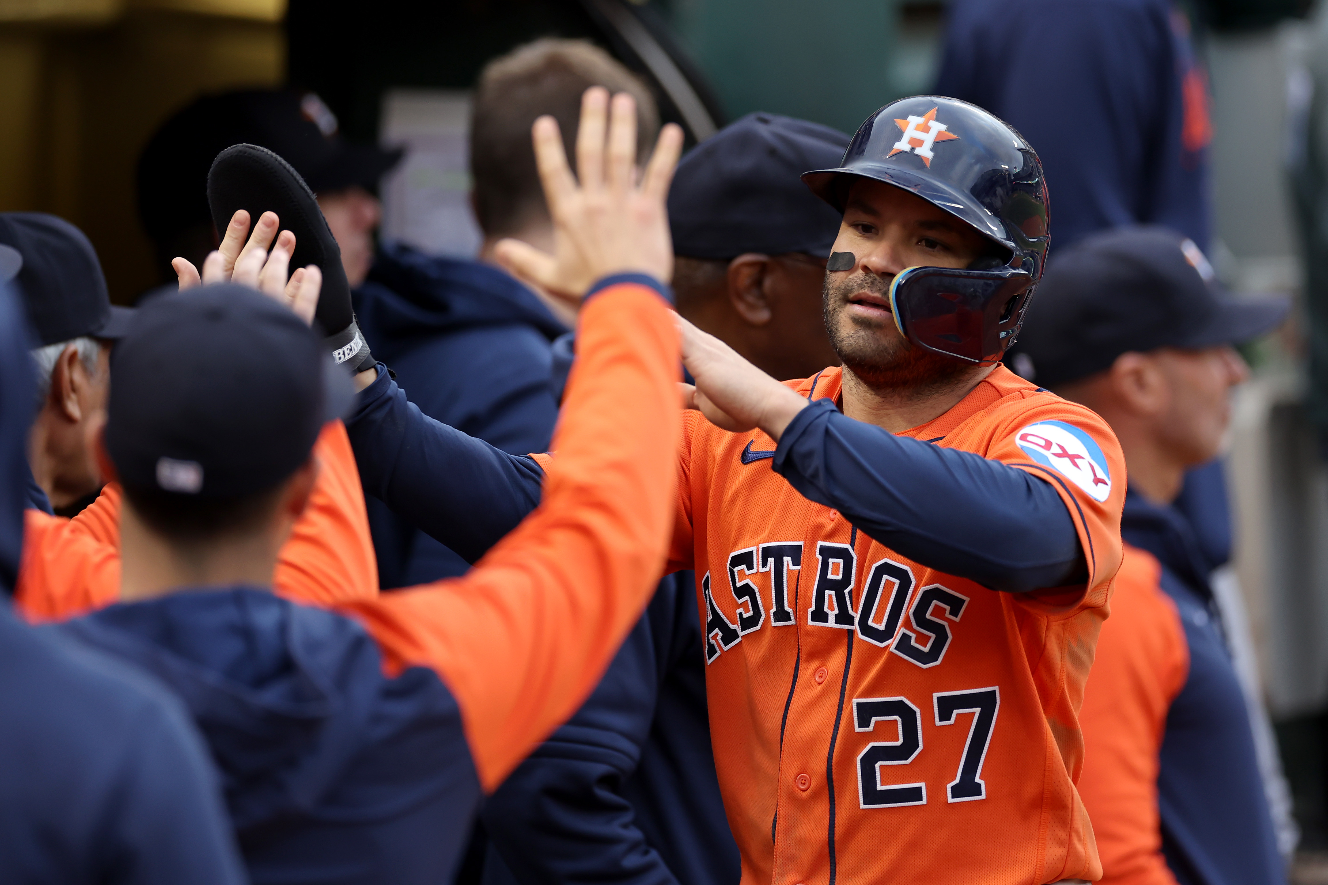 Jose Altuve of the Houston Astros is congratulated by teammates after he scored against the Oakland Athletics in the third inning at RingCentral Coliseum on May 26, 2023 in Oakland, California.