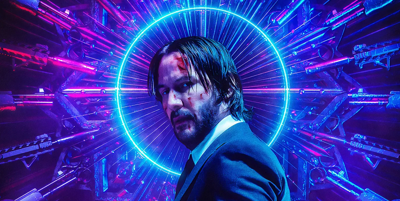 A poster shot for John Wick 3, featuring Keanu Reeves on a blue and purple background.