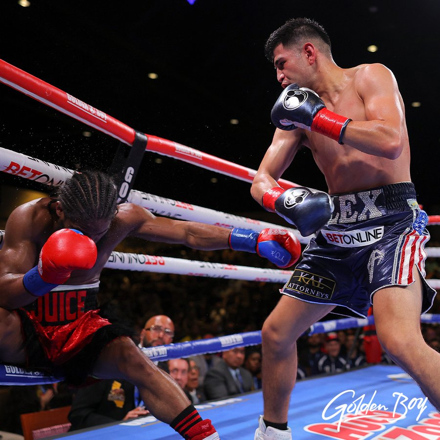 Alexis Rocha floors Anthony Young on a 5th round left hook