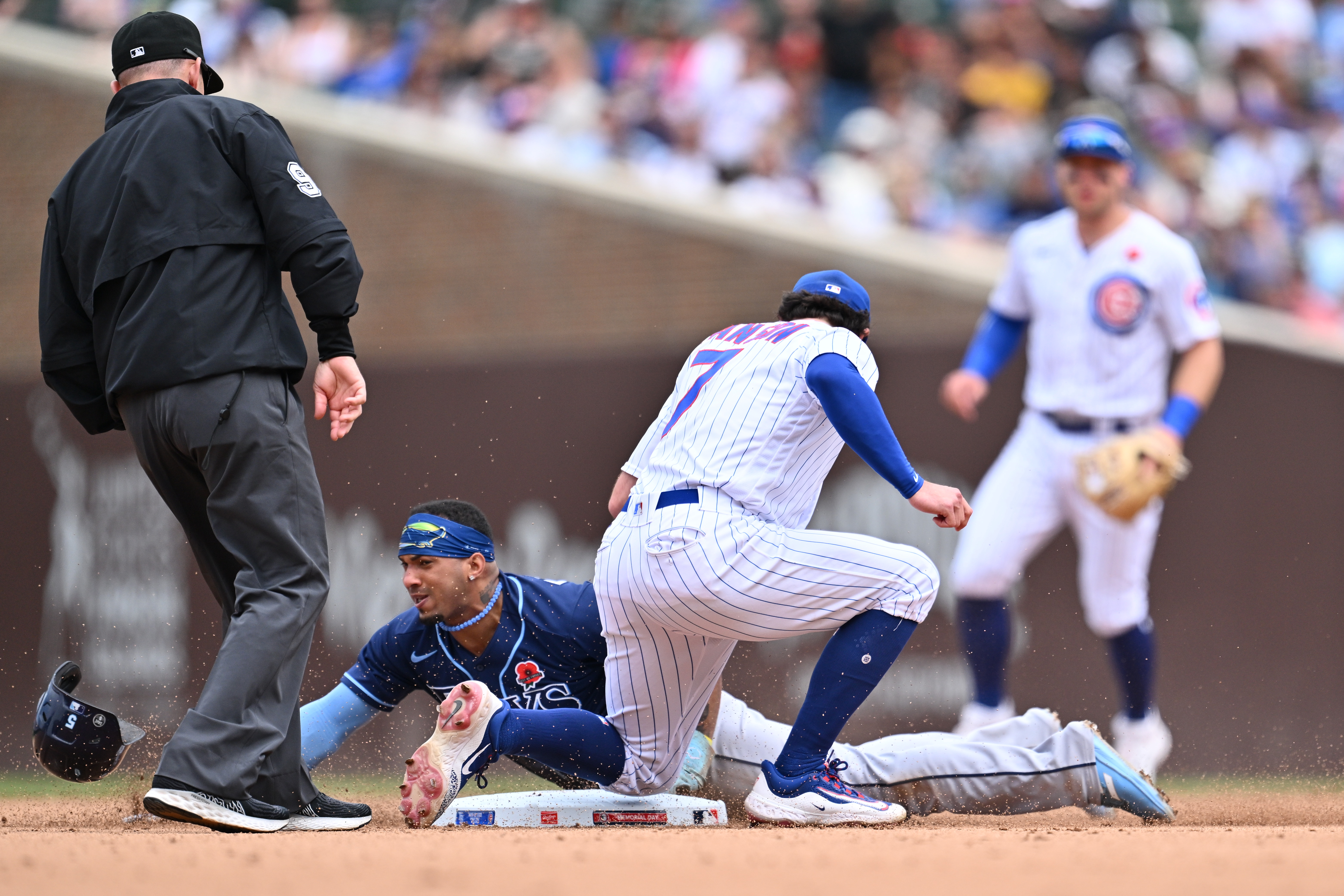 Wander Franco of the Tampa Bay Rays steals second base under the tag of Dansby Swanson #7 of the Chicago Cubs in the seventh inning at Wrigley Field on May 29, 2023 in Chicago, Illinois.