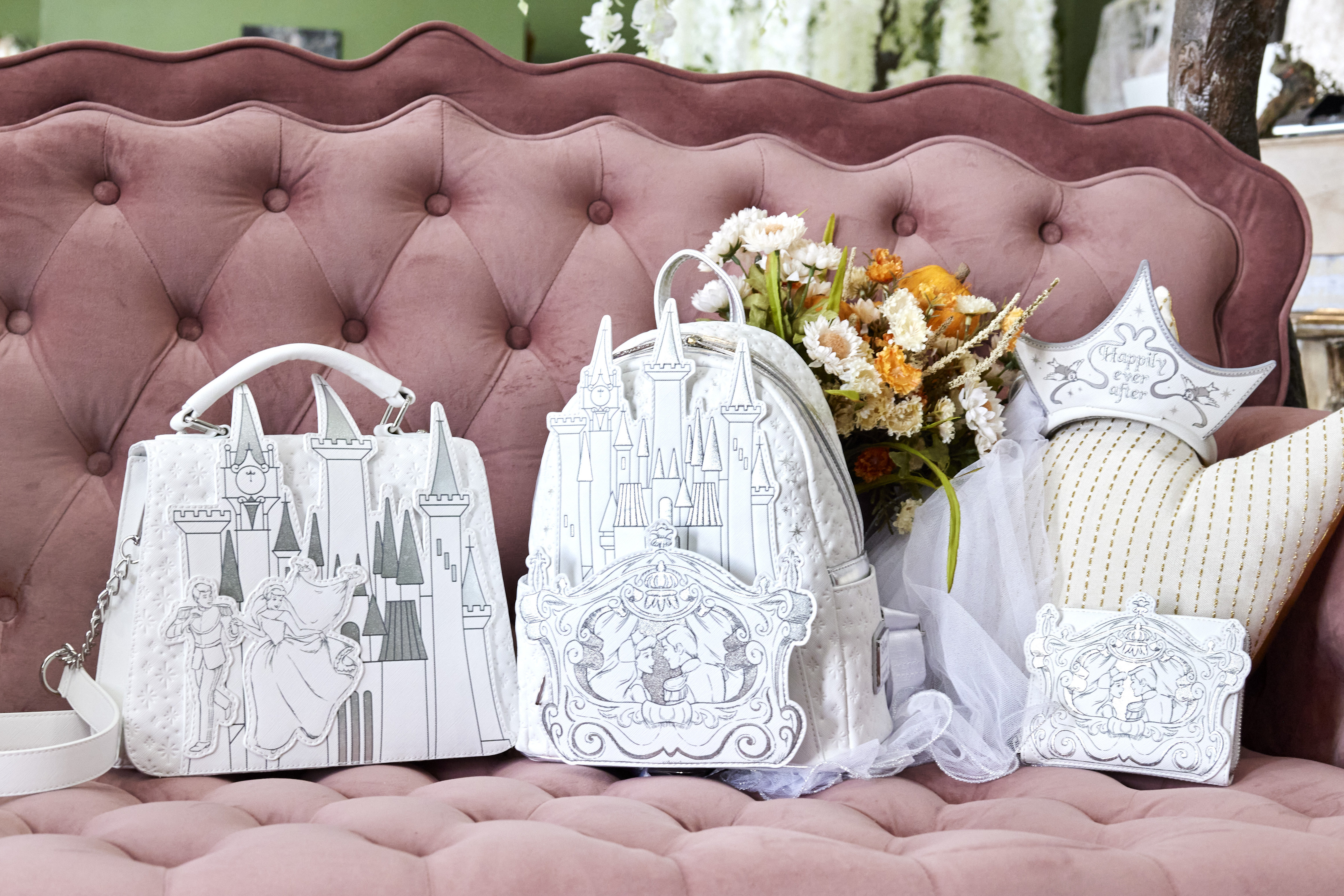 Loungefly and Disney’s Happily Ever After set of Cinderella accessories, including a headband, backpack, crossbody bag, wallet, and enamel pin.