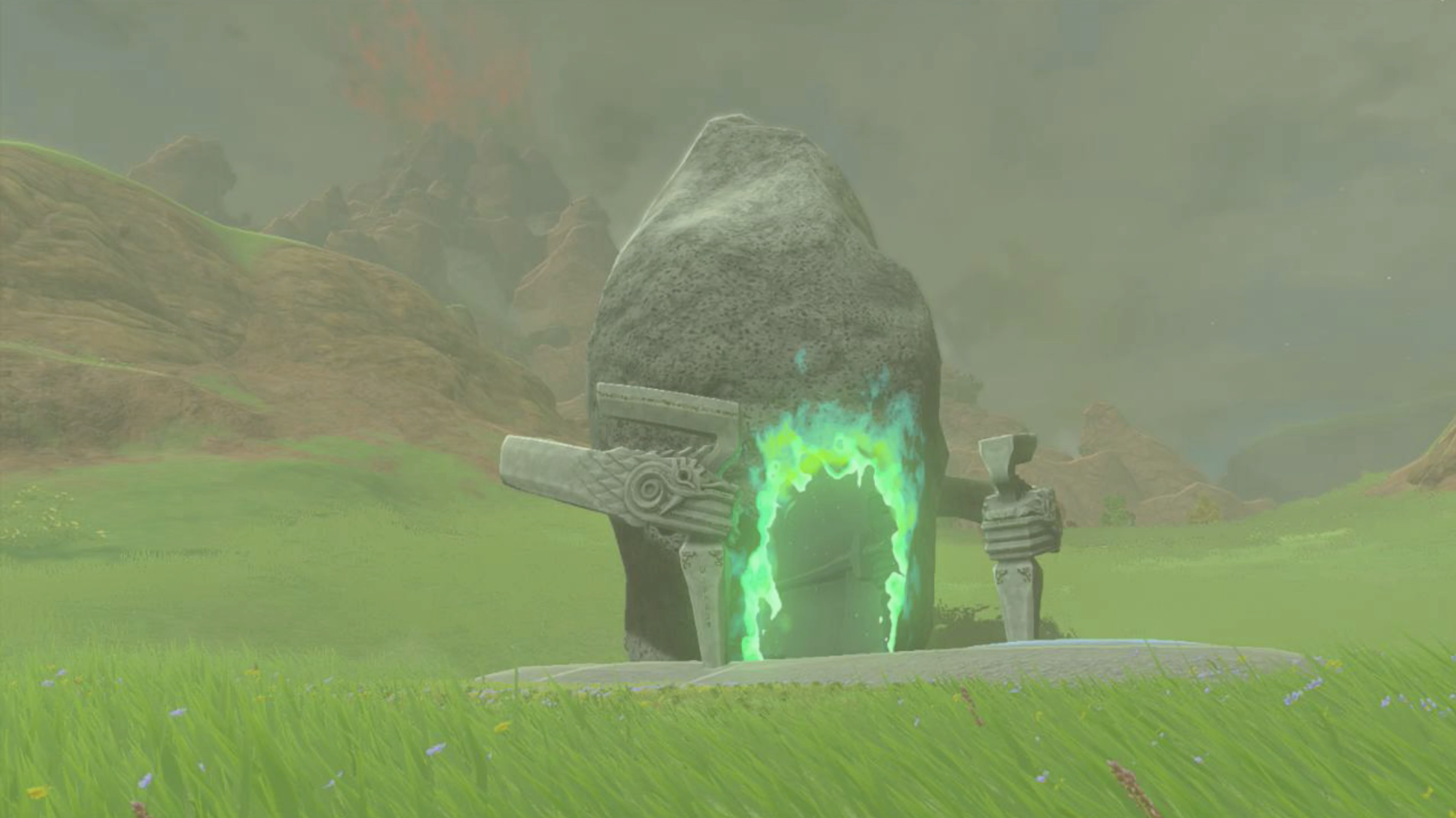Sinatanika Shrine in Zelda: Tears of the Kingdom. The shrine looks like a giant rock that has a portal that enters another room on it.
