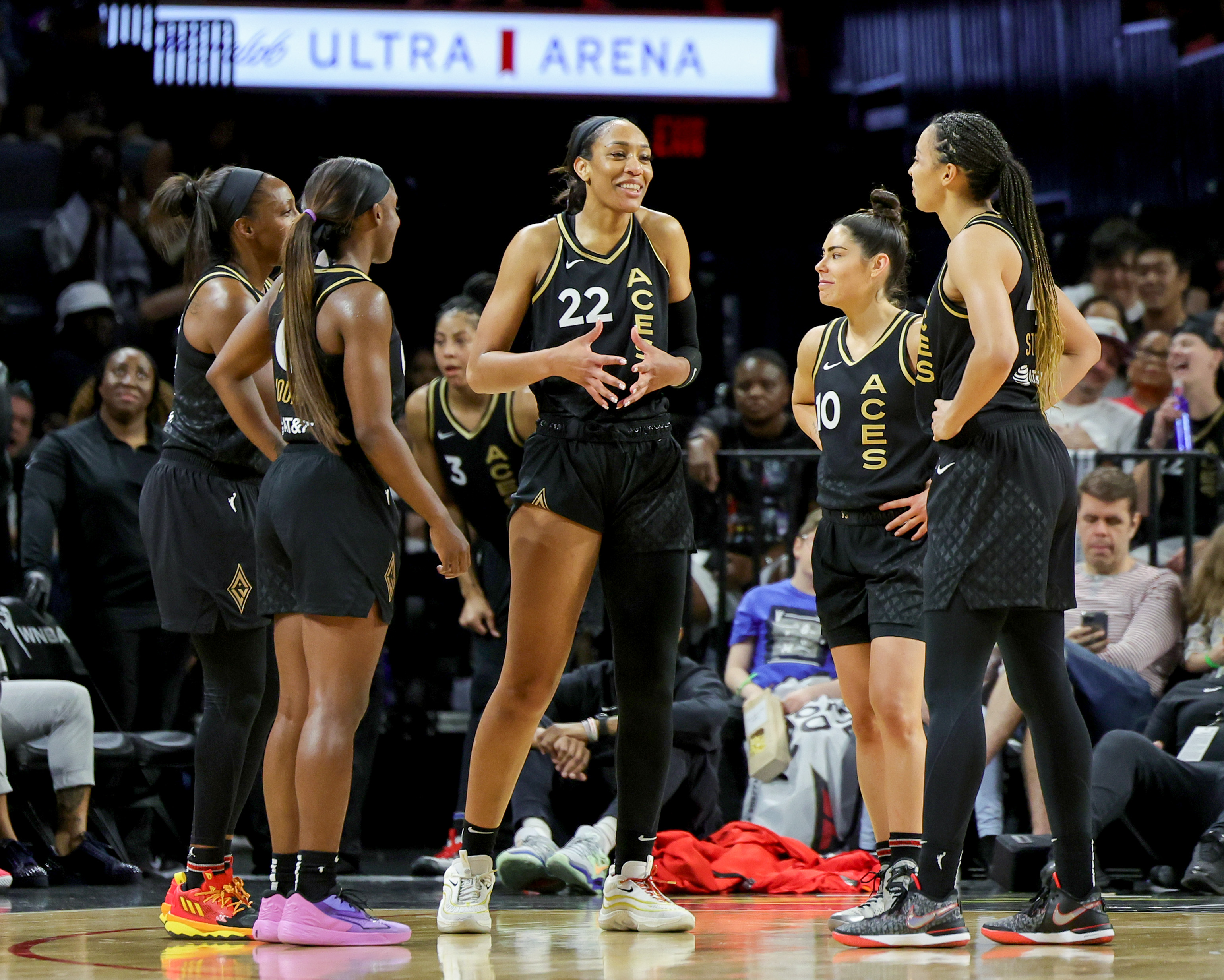LAS VEGAS, NEVADA - MAY 28: (L-R) Chelsea Gray #12, Jackie Young #0, A’ja Wilson #22, Kelsey Plum #10 and Kiah Stokes #41 of the Las Vegas Aces talk during a timeout in the fourth quarter of their game against the Minnesota Lynx at Michelob ULTRA Arena on May 28, 2023 in Las Vegas, Nevada. The Aces defeated the Lynx 94-73.&nbsp;