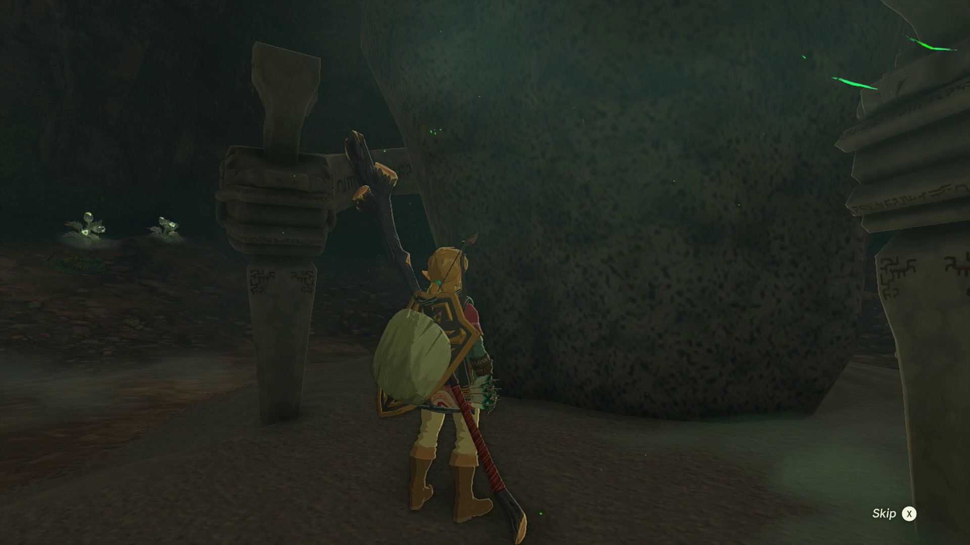 Link stands in front of Minetak Shrine, just before its door opens, in Zelda: Tears of the Kingdom