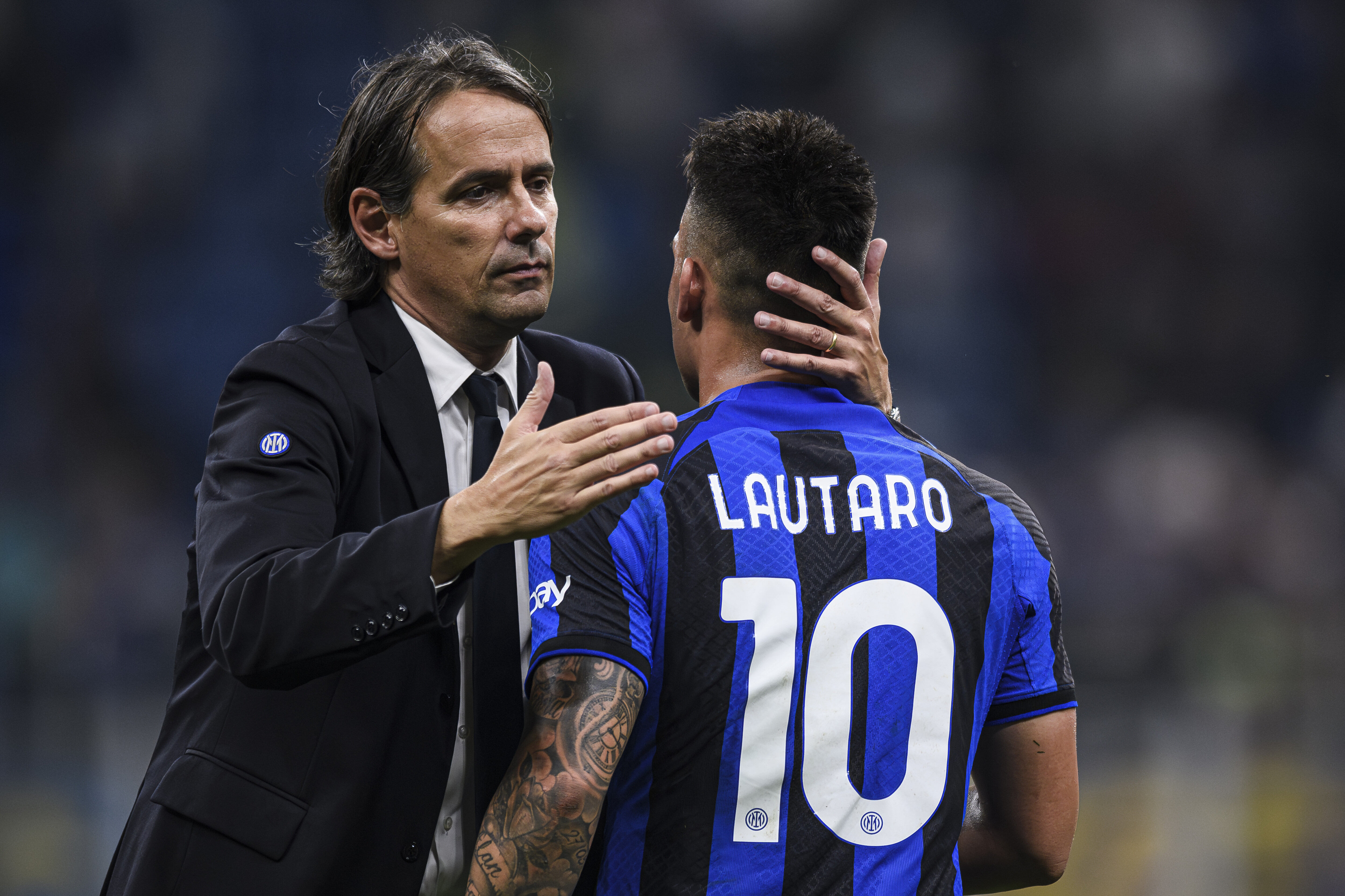 Simone Inzaghi (L), head coach of FC Internazionale, hugs...