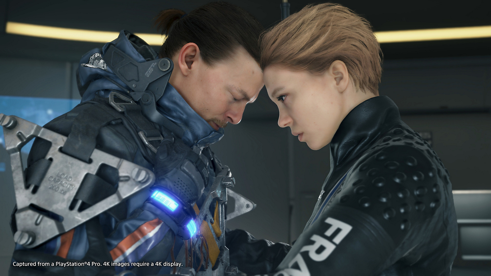 Sam Porter Bridges and Fragile press their heads together in a screenshot from Death Stranding