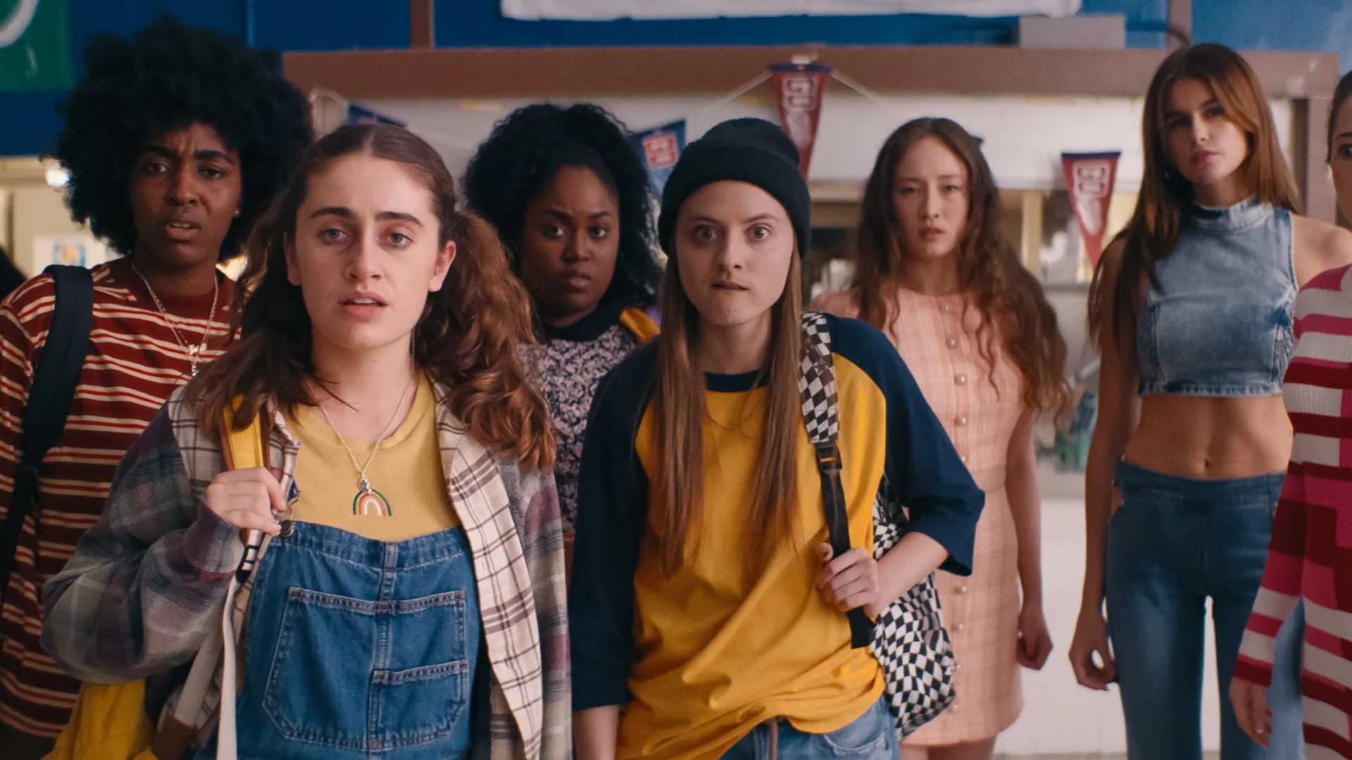 The ensemble cast of Bottoms, a group of high school girls, look towards the camera with looks of confusion and disgust.