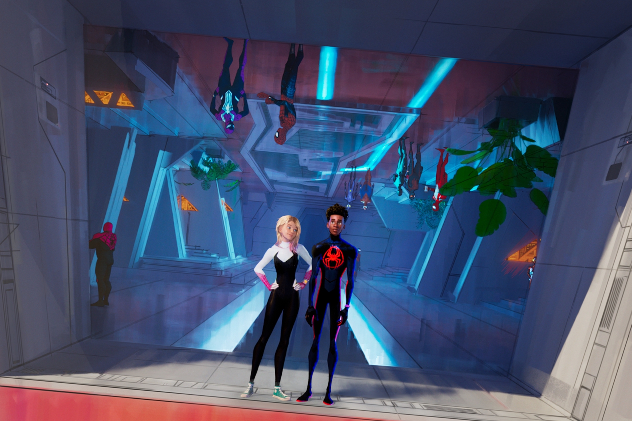 Gwen and Miles stand in the lobby of the spider-persons’ headquarters in Across the Spider-Verse. 