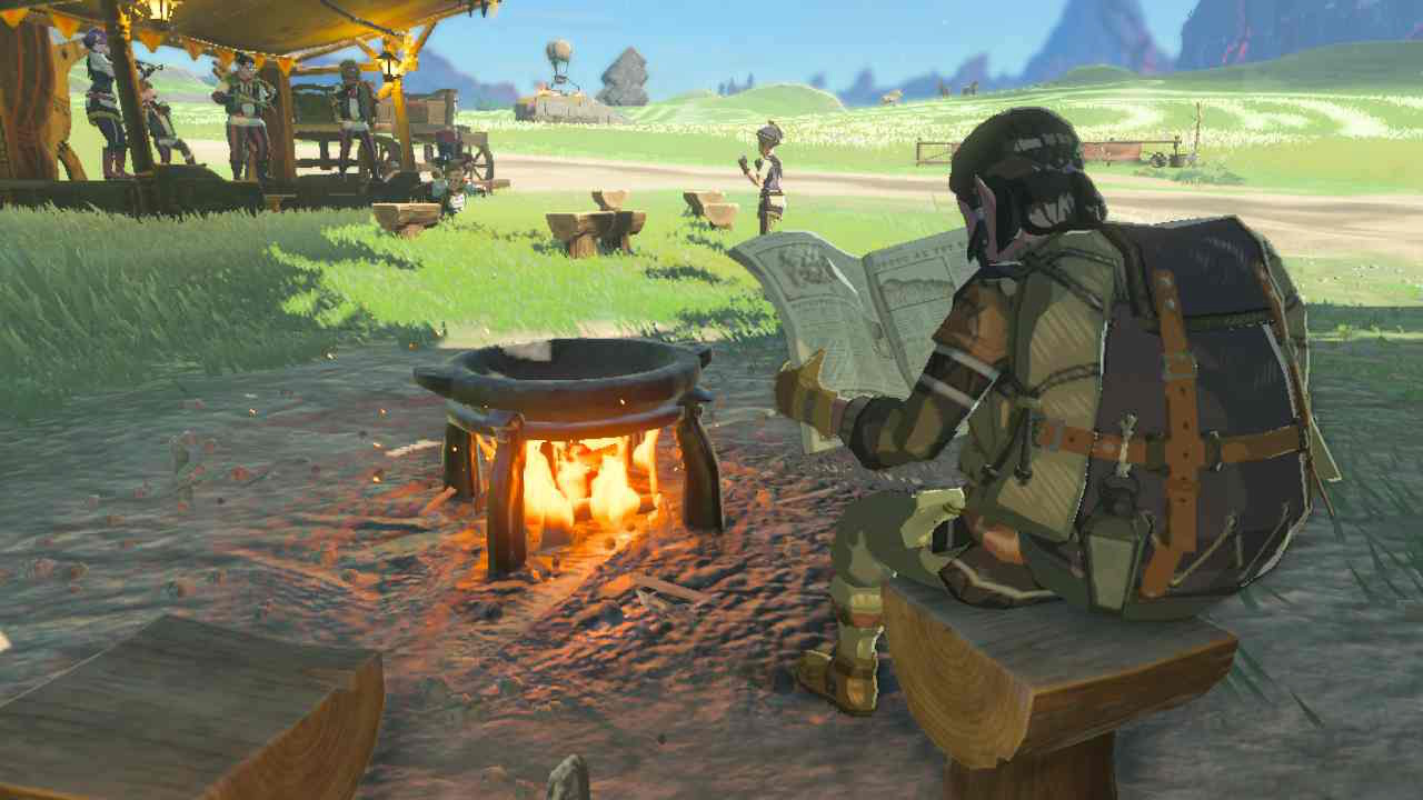 A Hylian resident reads the newspaper in front of a cooking pot in Zelda: Tears of the Kingdom