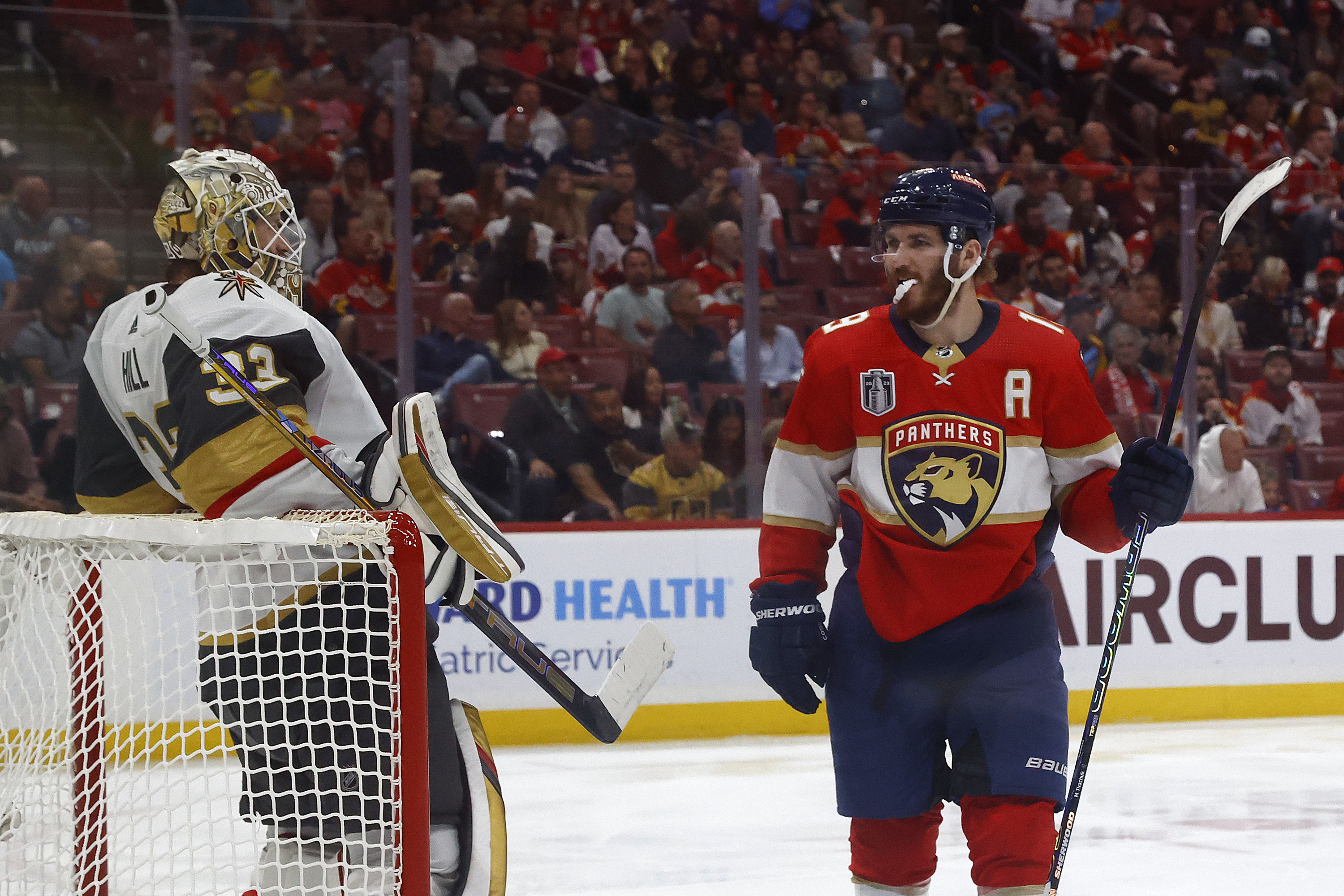Matthew Tkachuk of the Florida Panthers talks to goaltender Adin Hill of the Vegas Golden Knights as he skates past him in Game Four of the 2023 NHL Stanley Cup Final at the FLA Live Arena on May 24, 2023 in Sunrise, Florida.