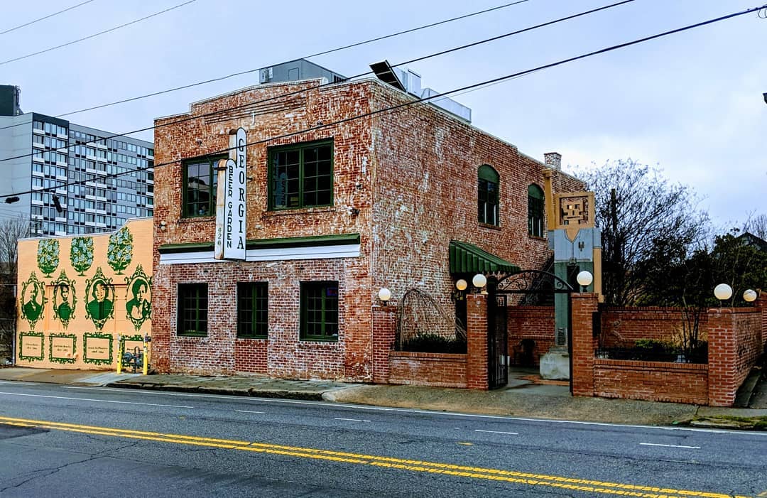 Looking toward the two-story brick building that is home to Georgia Beer Garden on a quick afternoon along Edgewood AVenue in Atlanta