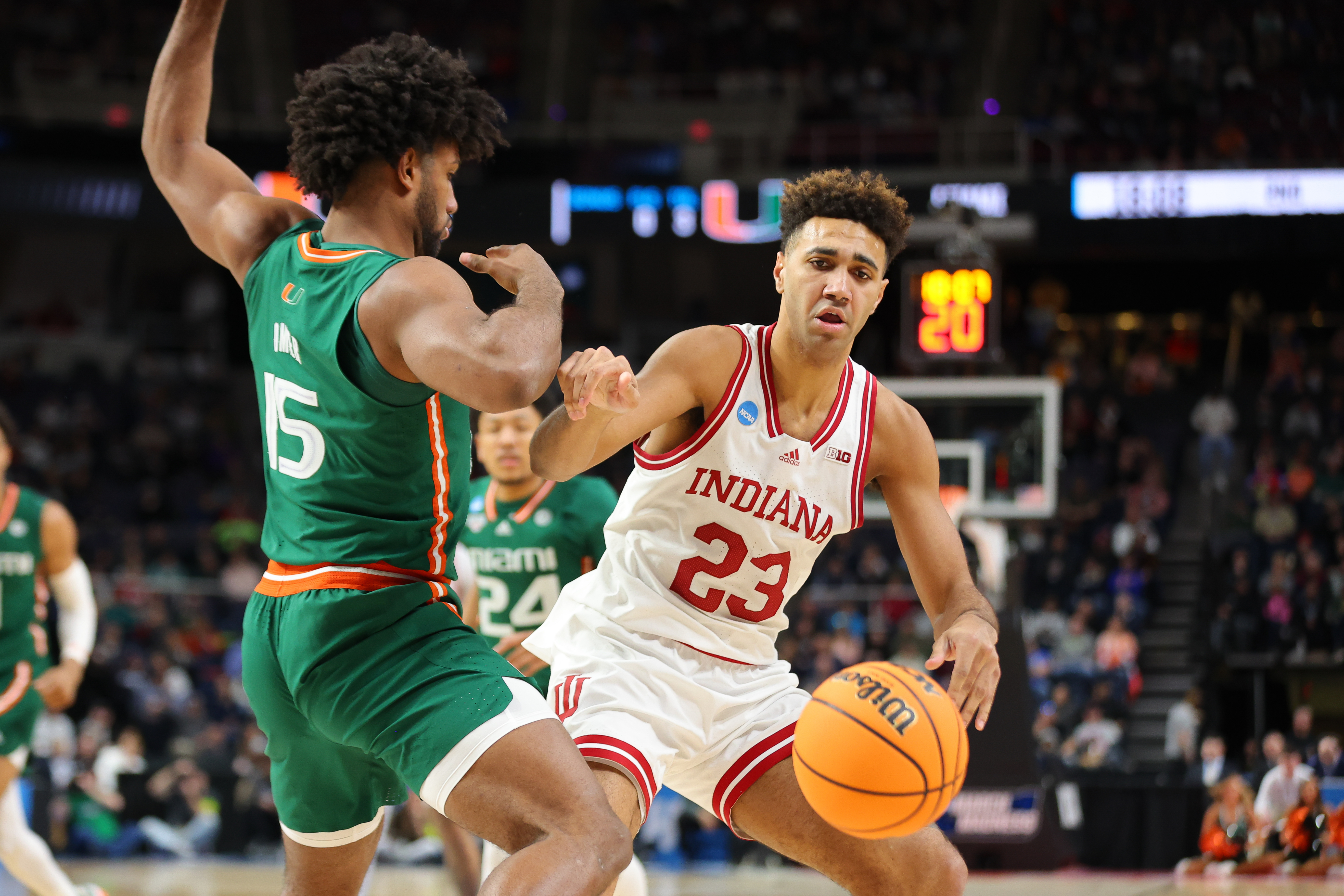 ALBANY, NY - MARCH 19: Trayce Jackson-Davis #23 of the Indiana Hoosiers dribbles against Norchad Omier #15 of the Miami Hurricanes during the second round of the 2023 NCAA Men’s Basketball Tournament held at MVP Arena on March 19, 2023 in Albany, New York.