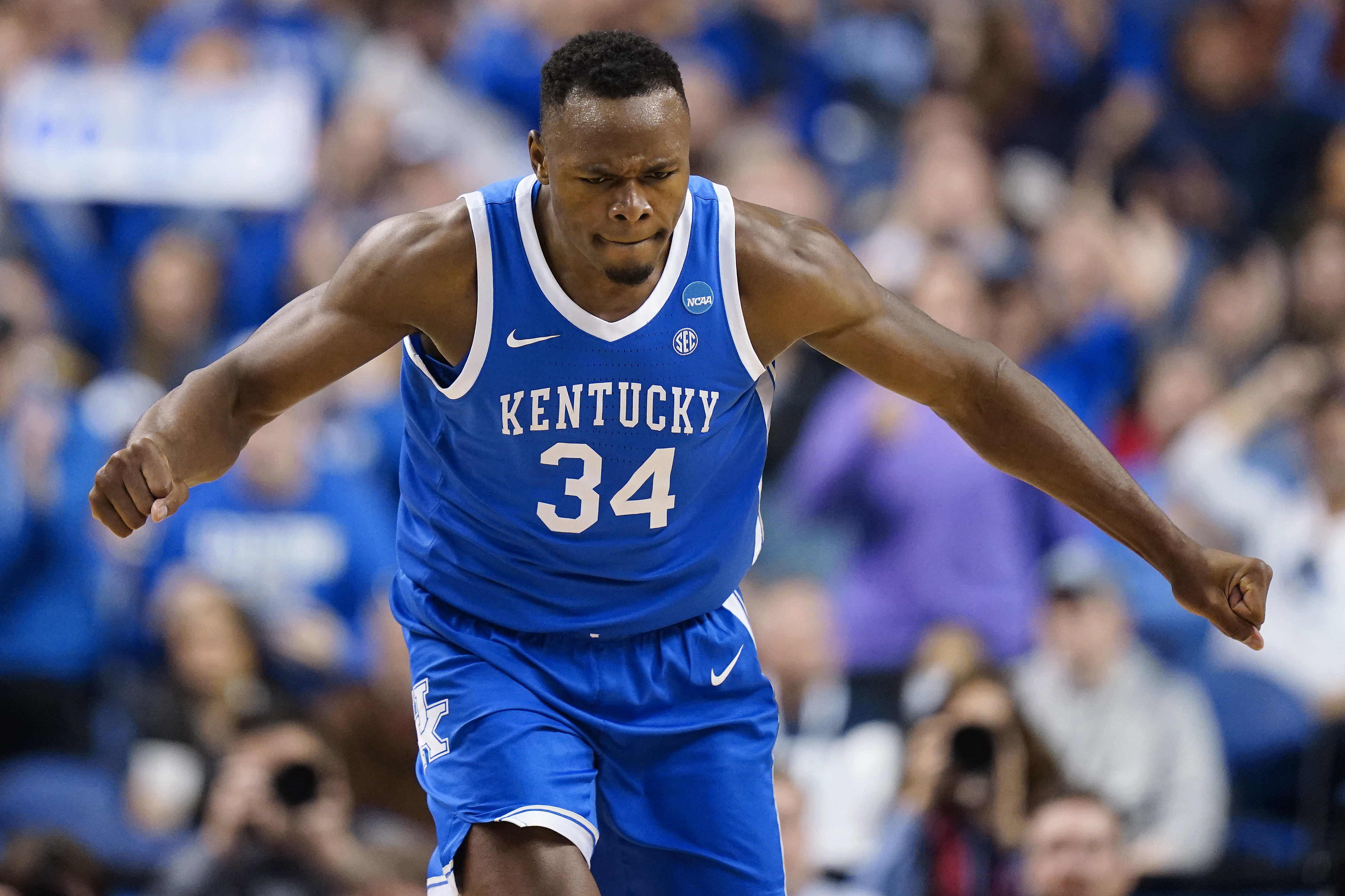Oscar Tshiebwe #34 of the Kentucky Wildcats reacts during the first half against the Kansas State Wildcats in the second round of the NCAA Men’s Basketball Tournament at The Fieldhouse at Greensboro Coliseum on March 19, 2023 in Greensboro, North Carolina.
