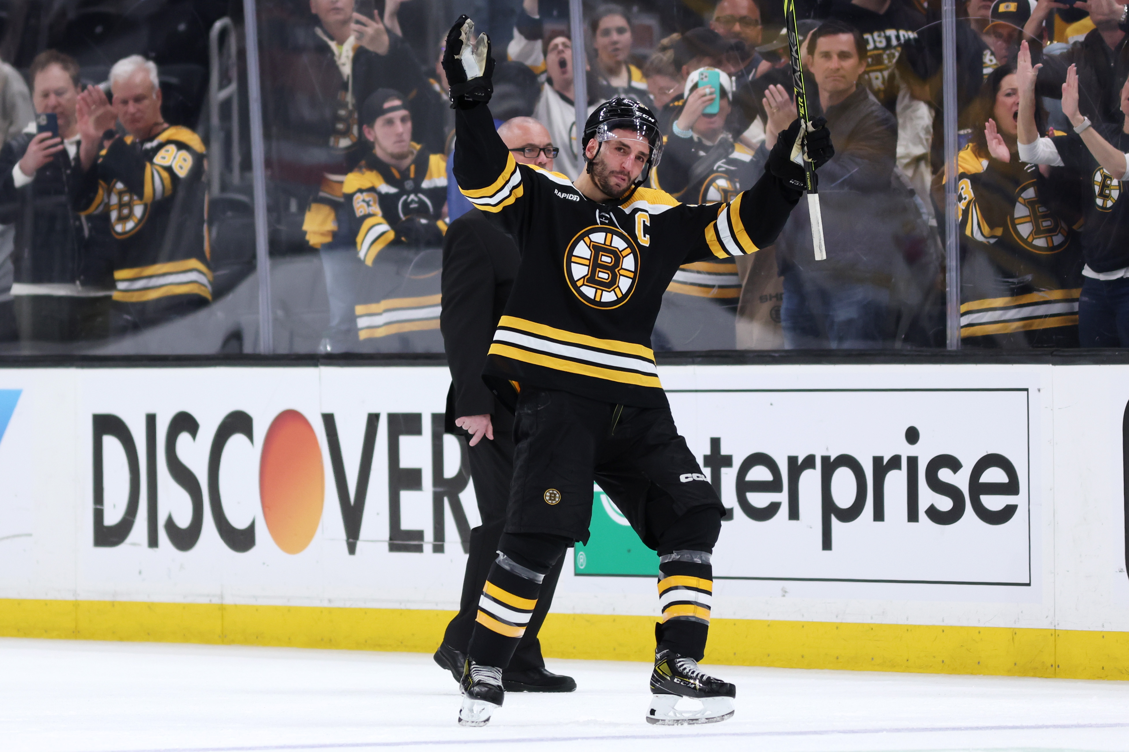 Patrice Bergeron of the Boston Bruins waves to fans before exiting the ice after Florida Panthers defeat the Bruins 4-3 in overtime of Game Seven of the First Round of the 2023 Stanley Cup Playoffs at TD Garden on April 30, 2023 in Boston, Massachusetts.