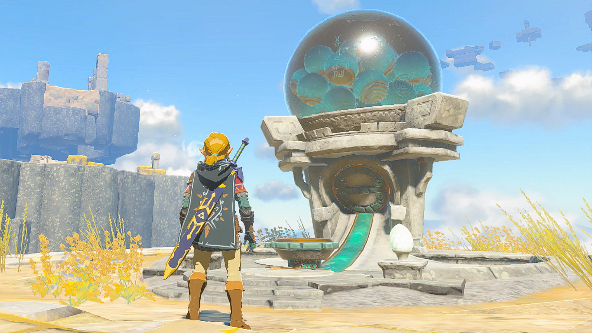 The Legend of Zelda: Tears of the Kingdom Link standing by a Zonai device dispenser on a Sky Island.