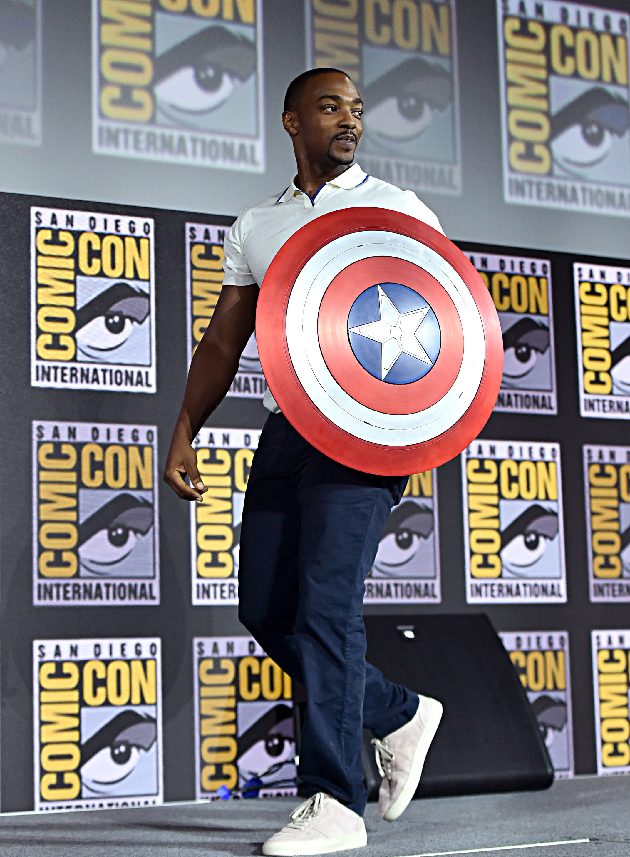 Anthony Mackie arrives to the Marvel Studios Hall H Panel holding the Captain America shield