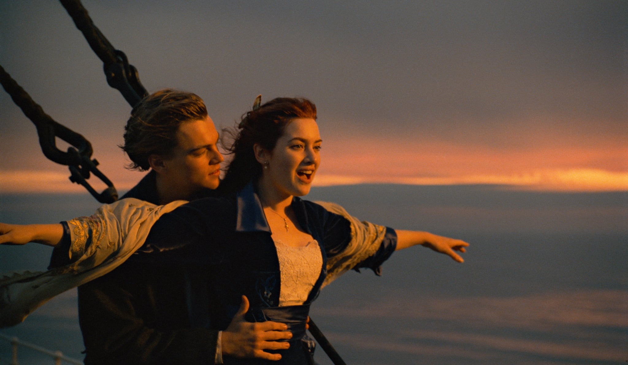 Jack (Leonardo DiCaprio) and Rose (Kate Winslet) standing atop the bow of the Titanic in Titanic.