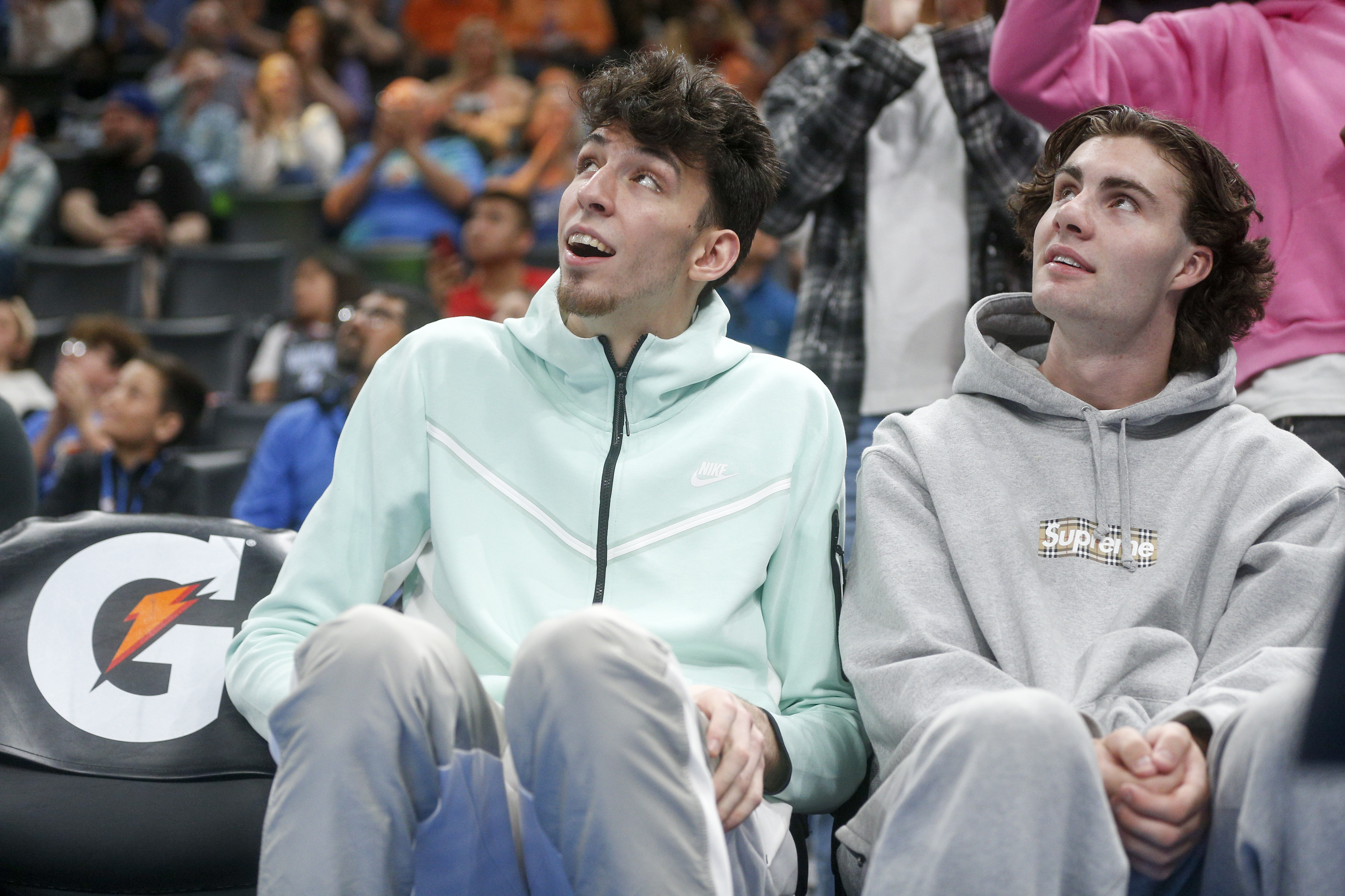 Chet Holmgren of the Oklahoma City Thunder and Josh Giddey of the Oklahoma City Thunder react while on the bench against the Memphis Grizzlies at Paycom Center on April 09, 2023 in Oklahoma City, Oklahoma.&nbsp;