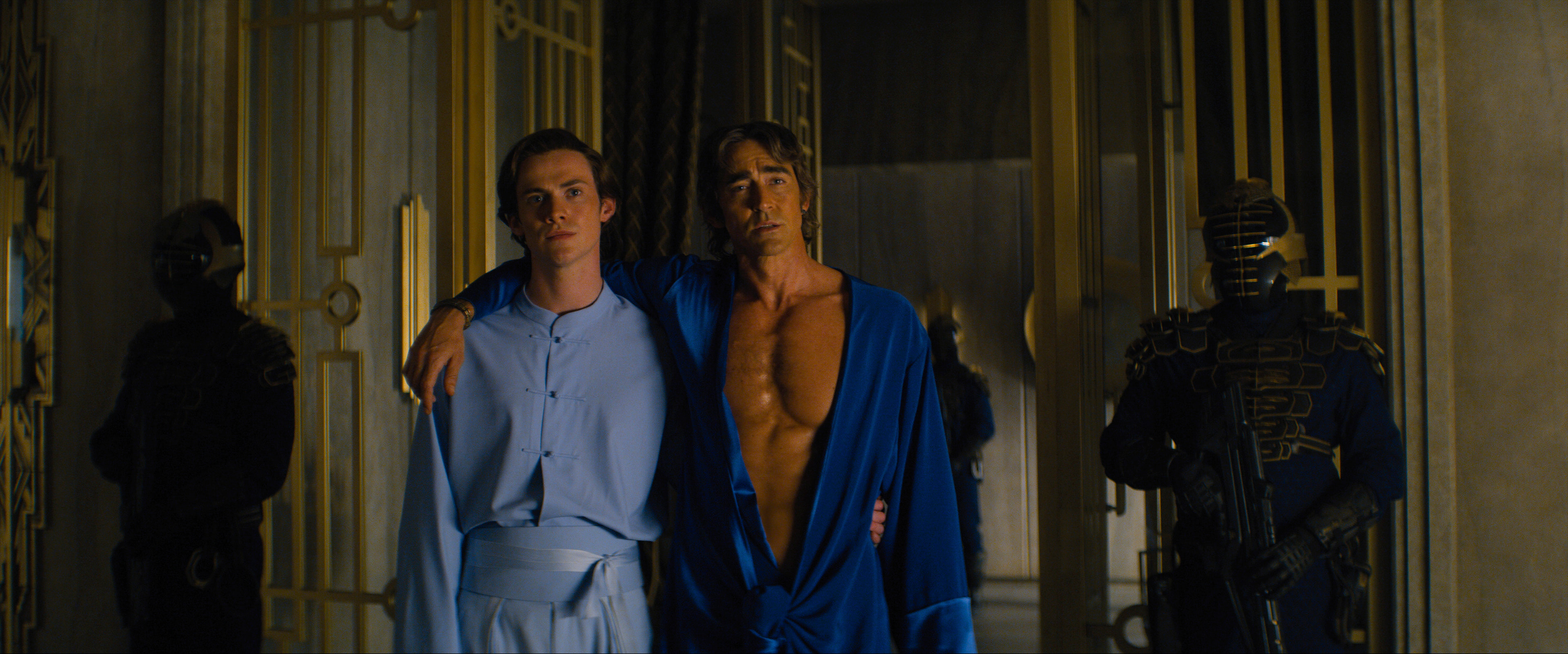 Brother Dawn (Cassian Dilton) standing with his arm around Brother Day (Lee Pace) in a still from Foundation 