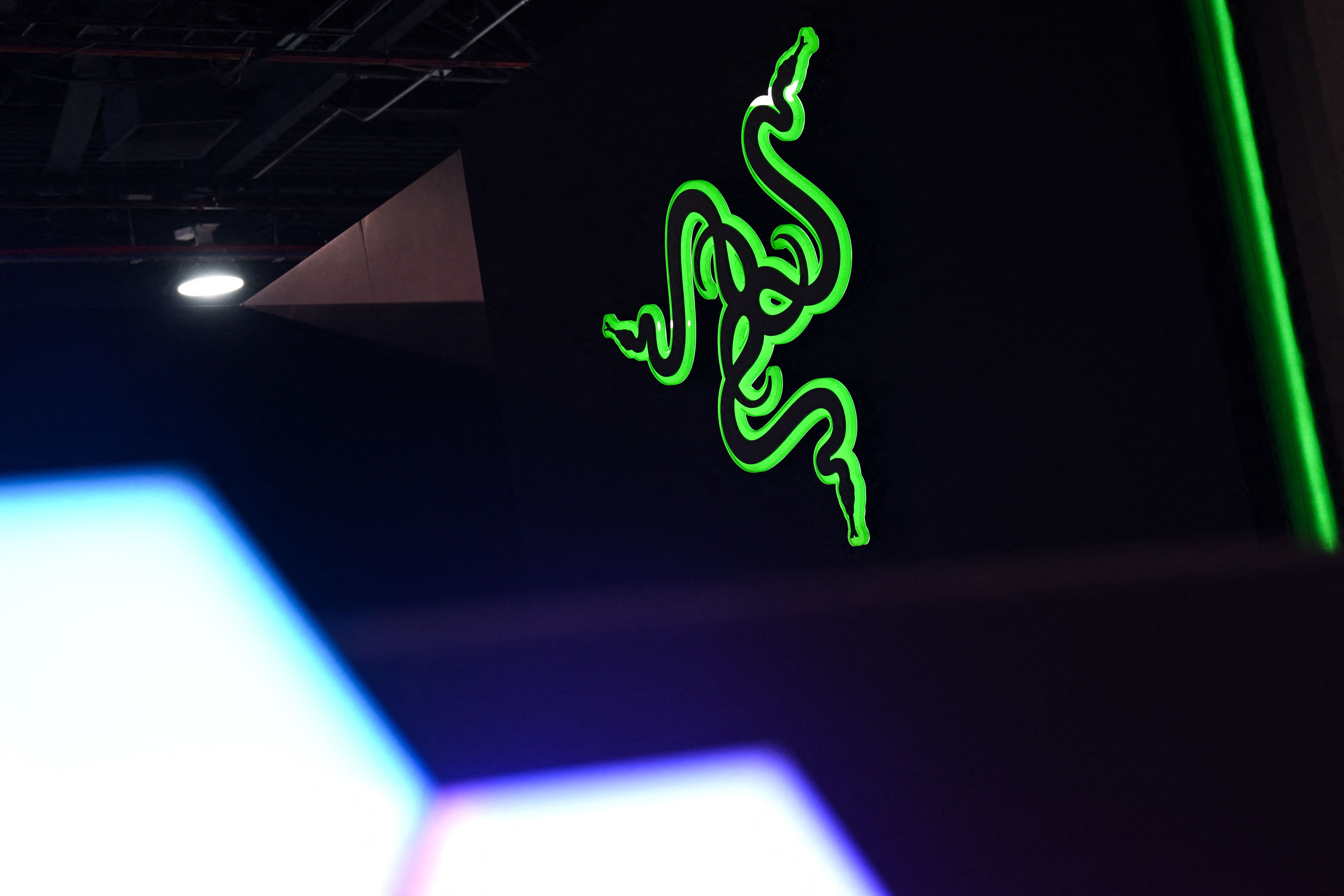 he Razer Inc. logo is displayed at the companys booth during the Consumer Electronics Show (CES) in Las Vegas, Nevada, on January 6, 2023. (Photo by Patrick T. Fallon / AFP)