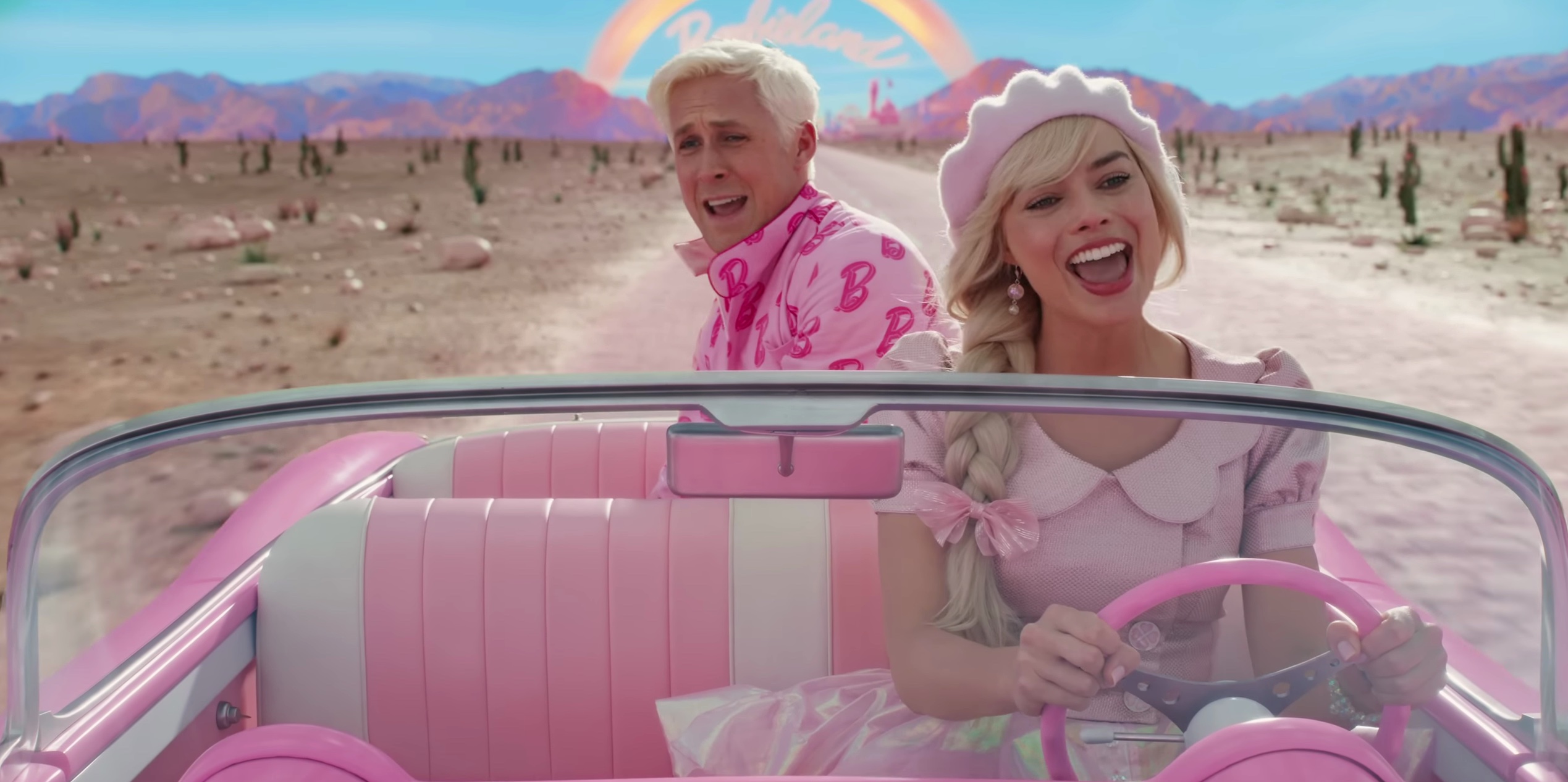Barbie (Margot Robbie) and Ken (Ryan Gosling) sing in the Barbiemobile out of Barbie land in Barbie
