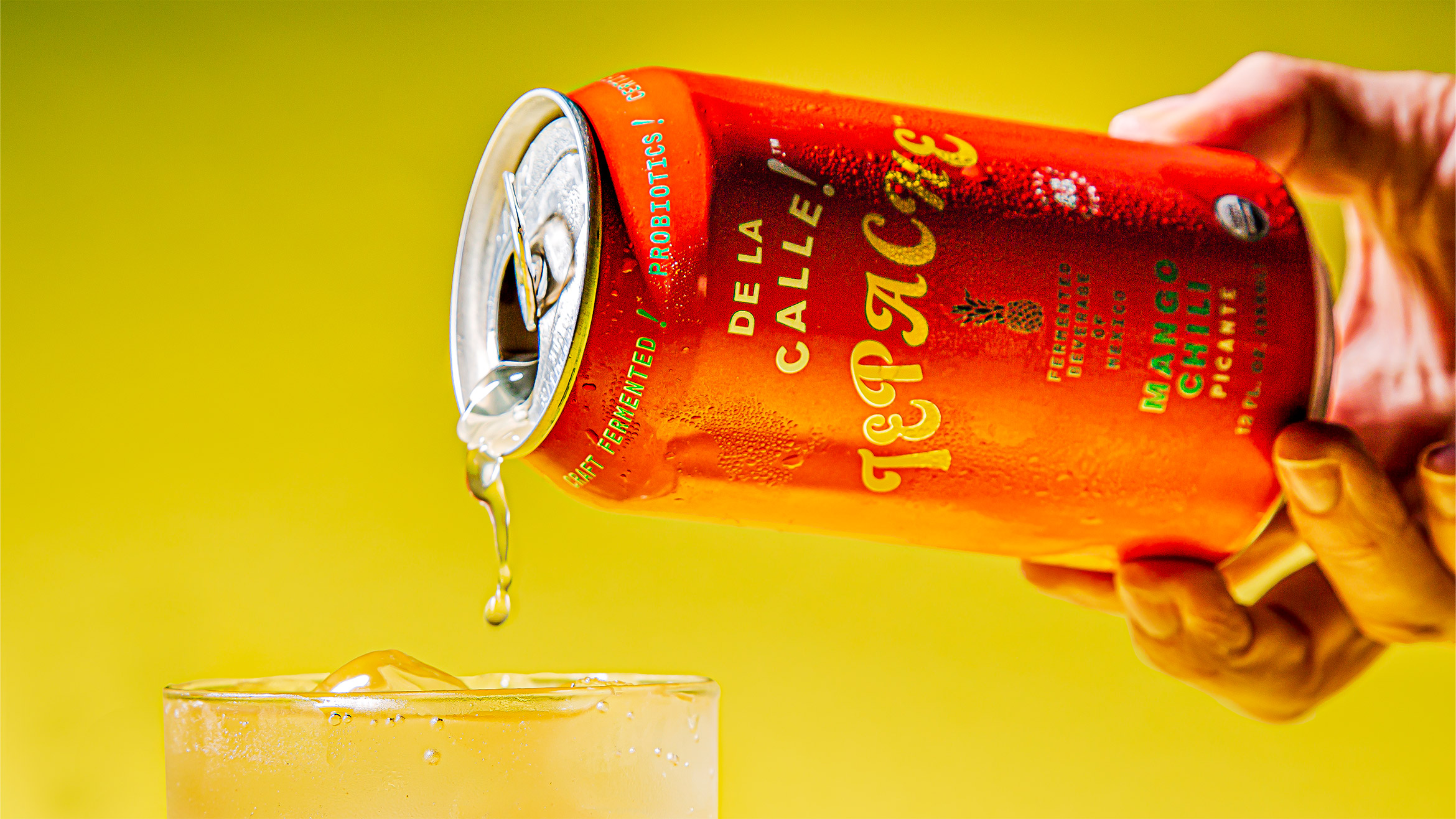 A can of Tepache is poured into a glass.