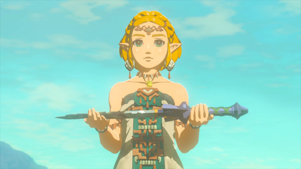Zelda presents the Master Sword, while facing the camera in front of a clear blue sky, in The Legend of Zelda: Tears of the Kingdom