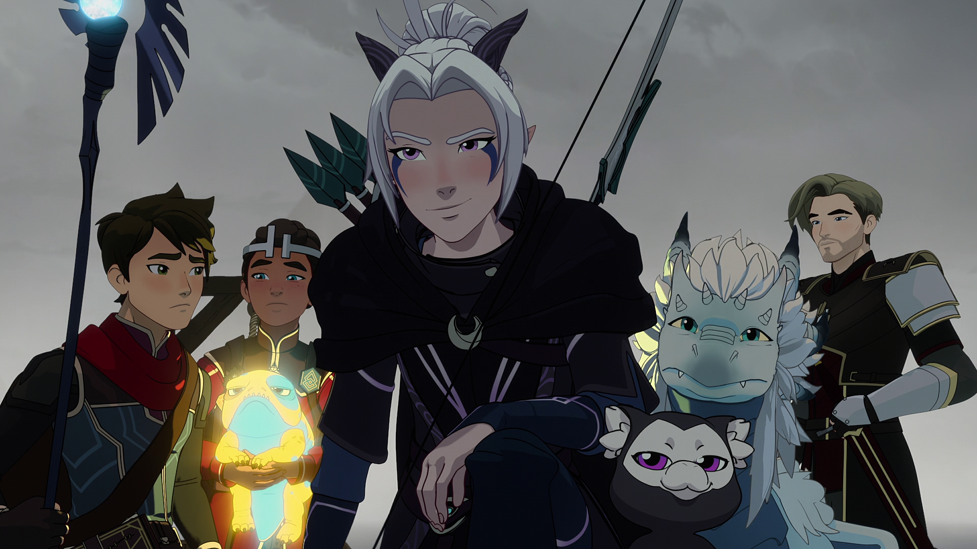 A white-haired elf assassin smirks as she kneels down, a band of adventurers including a mage, a king, and a knight (along with a little dragon) standing behind her.