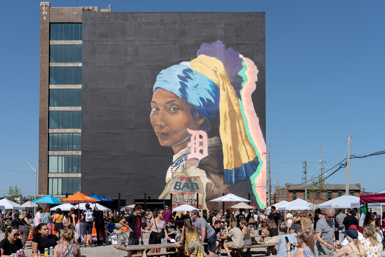 The Girl with the D Earring mural painted by Sydney James in Detroit, Michigan.