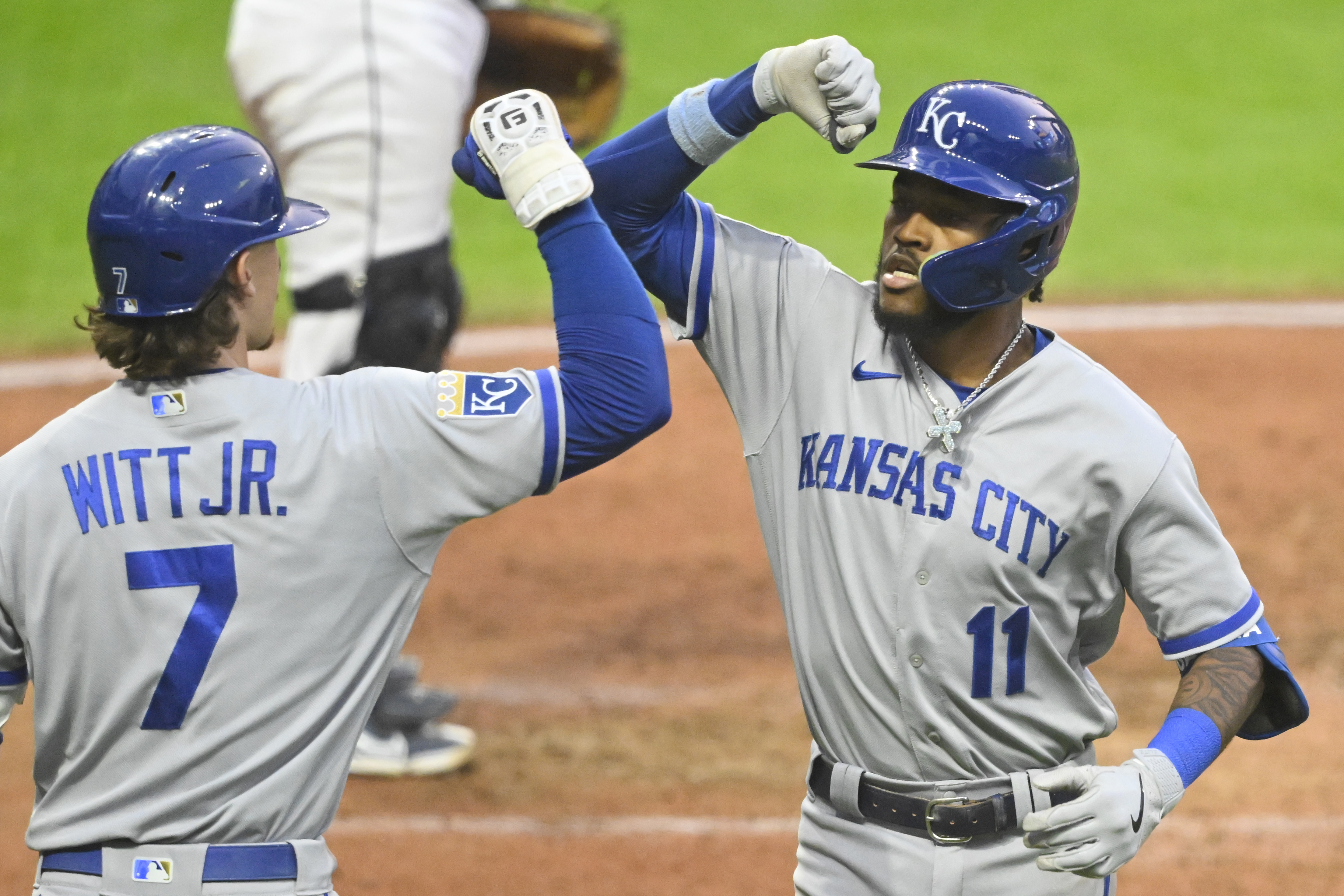 Kansas City Royals third baseman Maikel Garcia (11) celebrates his solo home run with shortstop Bobby Witt Jr. (7) in the seventh inning against the Cleveland Guardians at Progressive Field.