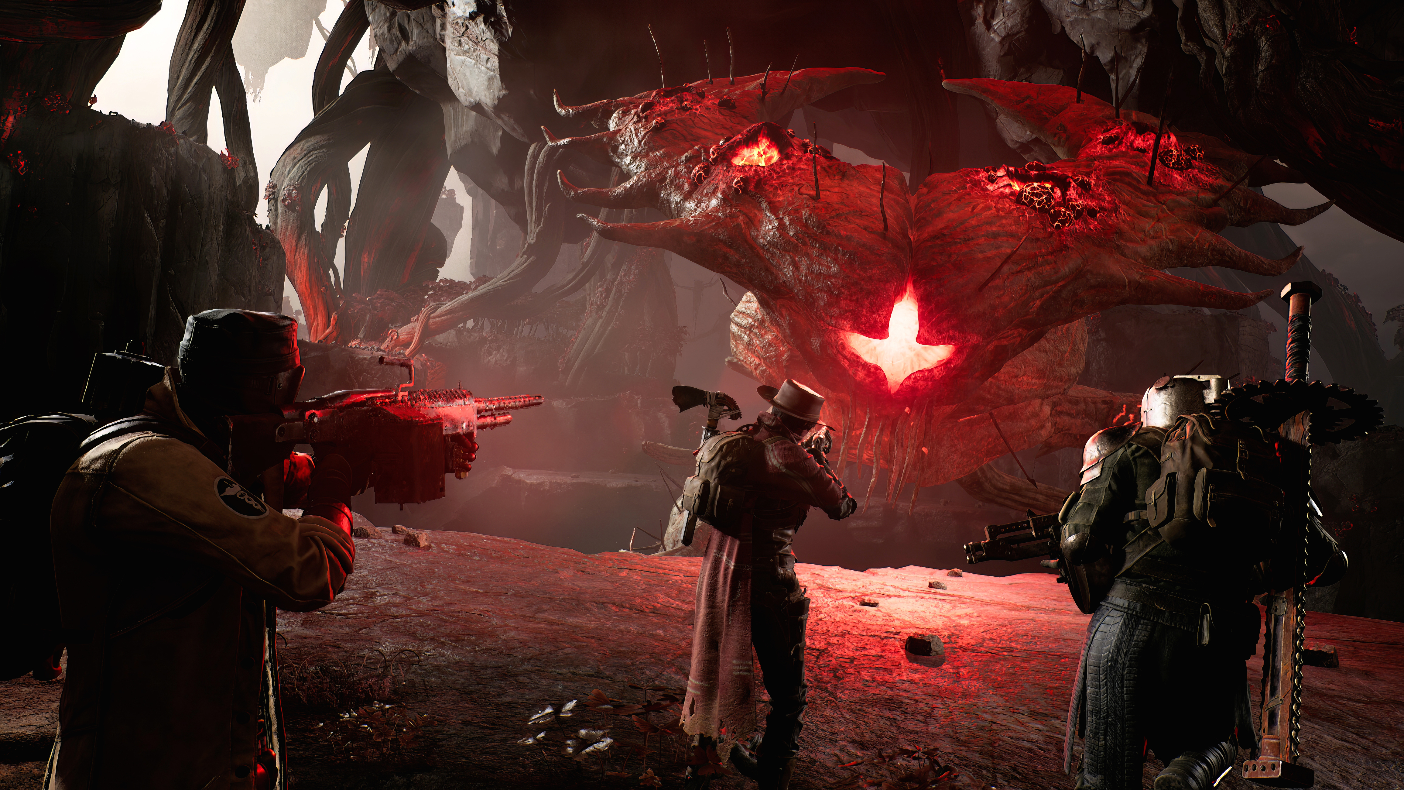 Three player chartacters aim their weapons at a large, glowing, insectoid enemy in Remnant 2
