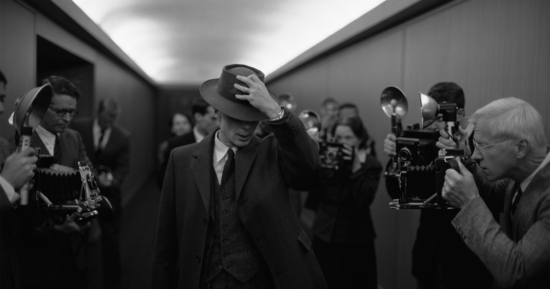 Cillian Murphy as J. Robert Oppenheimer in a brimmed hat and well-cut suit