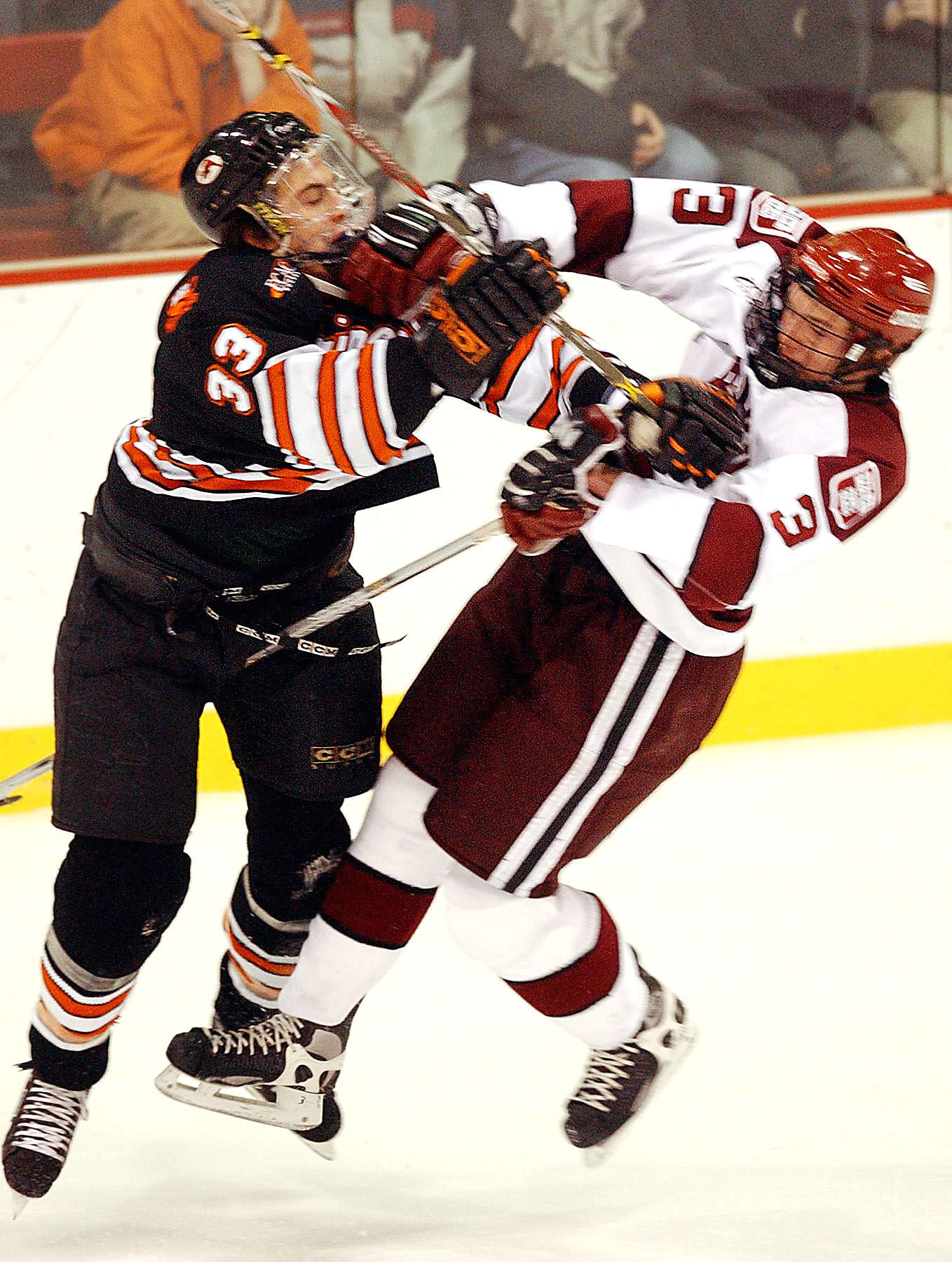 (01/11/03-Brighton, MA)HARVARD V PRINCETON— Harvard’sPeter Hafner (right) and Princeton’s George Parros collide during the first period at the Bright Hockey Center on Saturday afternoon. (011103harvardkw-Staff PHoto by Kevin Wisniewski. Saved in Pho