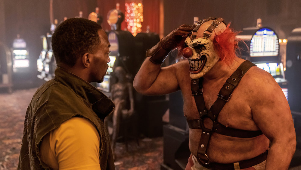 Sweet Tooth, the evil clown, salutes Anthony Mackie’s John Doe in the Peacock series Twisted Metal